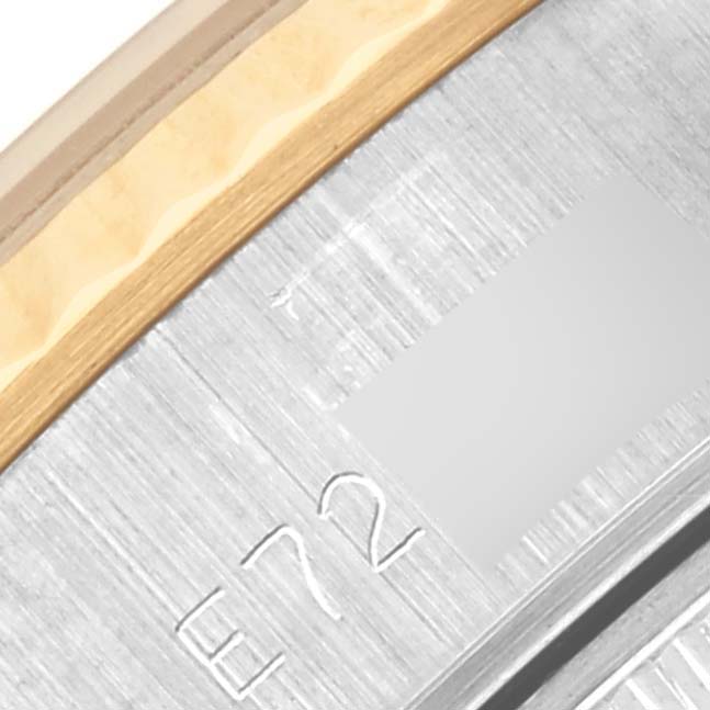 The image shows a close-up of the Rolex Datejust 69173 Women's Steel and Gold (two tone) Champagne Dial 69173 Women's Steel and Gold (two tone) Champagne Dial's side, highlighting the bezel and part of the case with engraved numbers.
