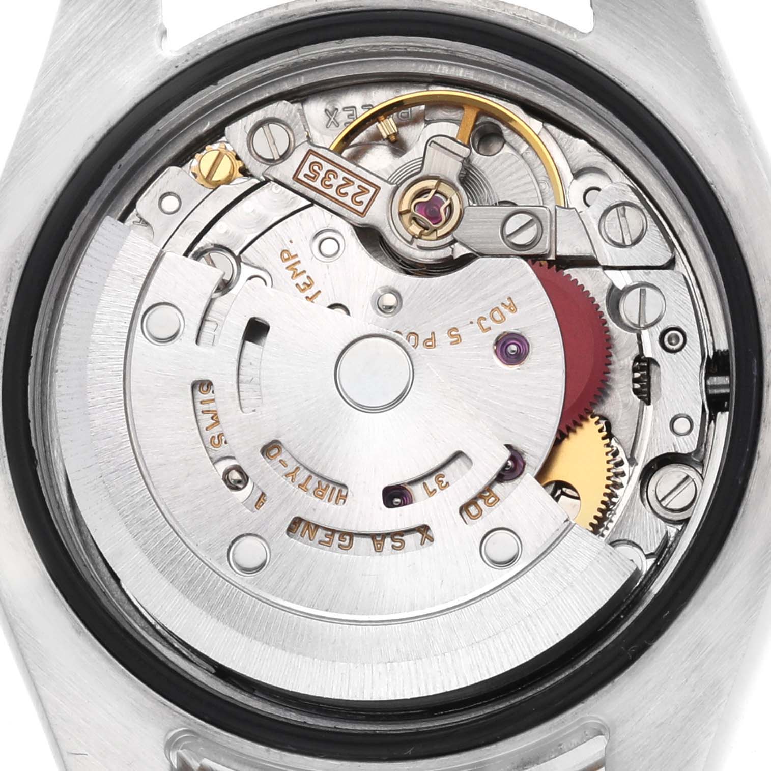 The image shows the internal mechanism of a Rolex Datejust 179173 Women's Steel and Gold (two tone) Champagne Dial watch from a top-down angle, revealing the movement components.