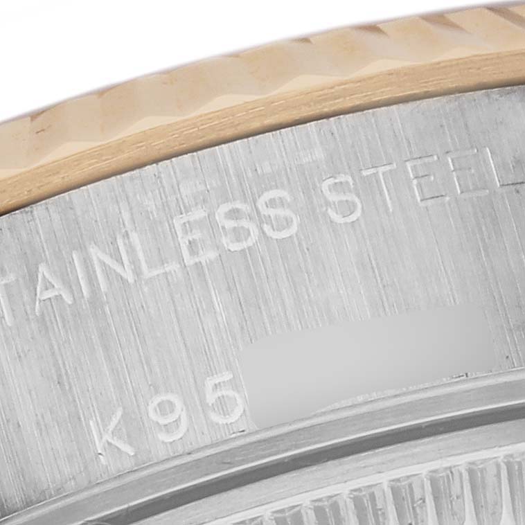 The image shows a close-up of the Rolex Datejust 79173 Women's Steel and Gold (two tone) White Dial 79173 Women's Steel and Gold (two tone) White Dial model's case, highlighting the stainless steel text and part of the bezel.