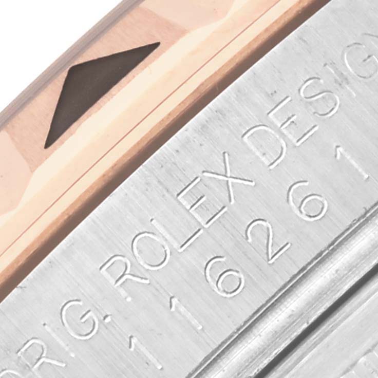 The image shows a close-up of the bezel and engraved case edge of the Rolex Turn-o-Graph 116261 Men's Steel and Gold (two tone) Black Dial 116261 Men's Steel and Gold (two tone) Black Dial.