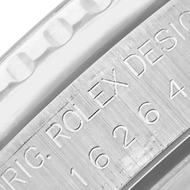 The image shows a close-up of the engraved model and serial number on the side of the Rolex Turn-o-Graph 16264 Men's Stainless Steel Silver Dial 16264 Men's Stainless Steel Silver Dial watch case.