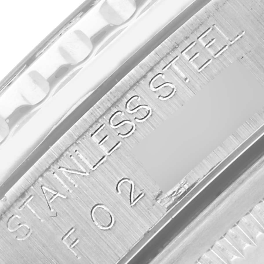 The image shows a close-up of the stainless steel engravings on the side of a Rolex Turn-o-Graph 16264 Men's Stainless Steel Silver Dial 16264 Men's Stainless Steel Silver Dial watch.