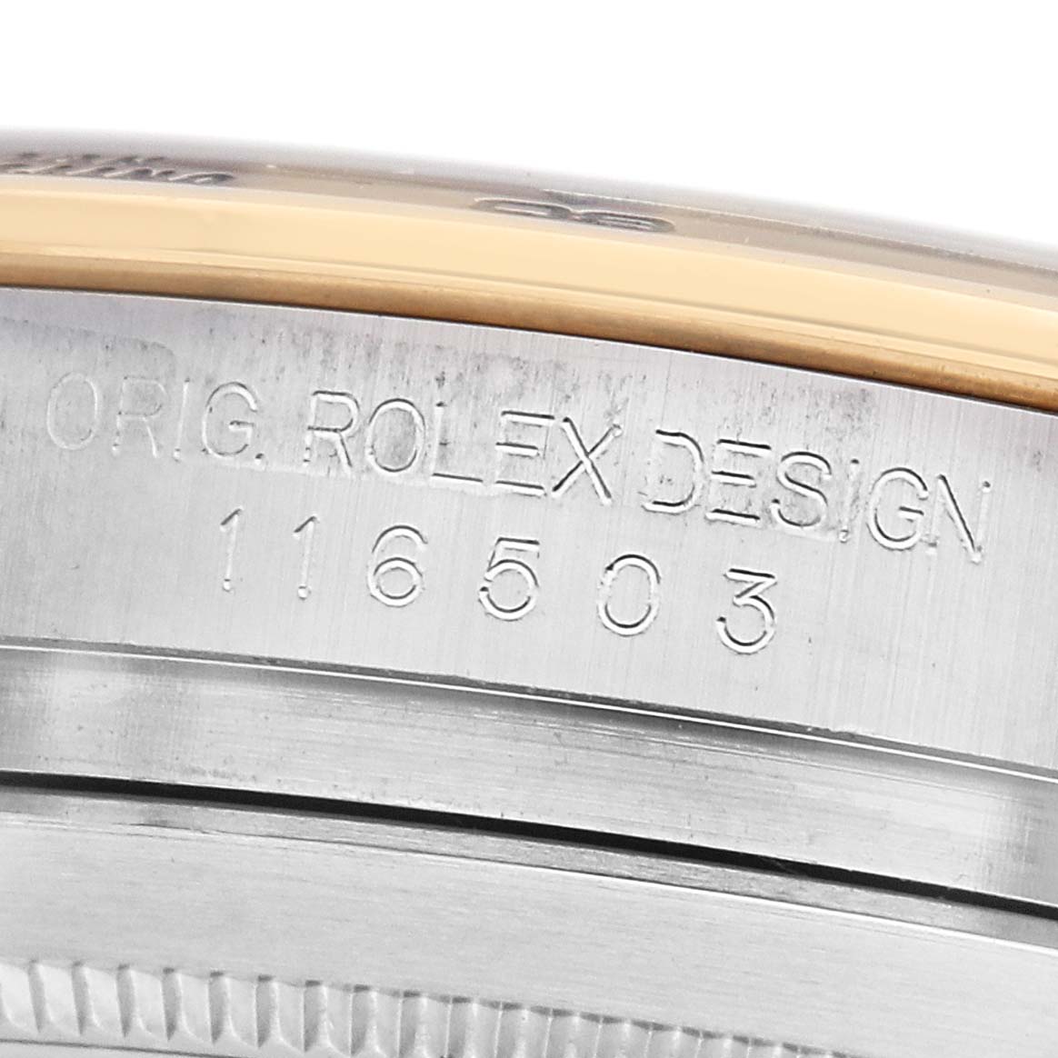 The image shows a close-up of the side of a Rolex Daytona 116503 Men's Steel and Gold (two tone) Black Dial watch case, highlighting the engraved model number.