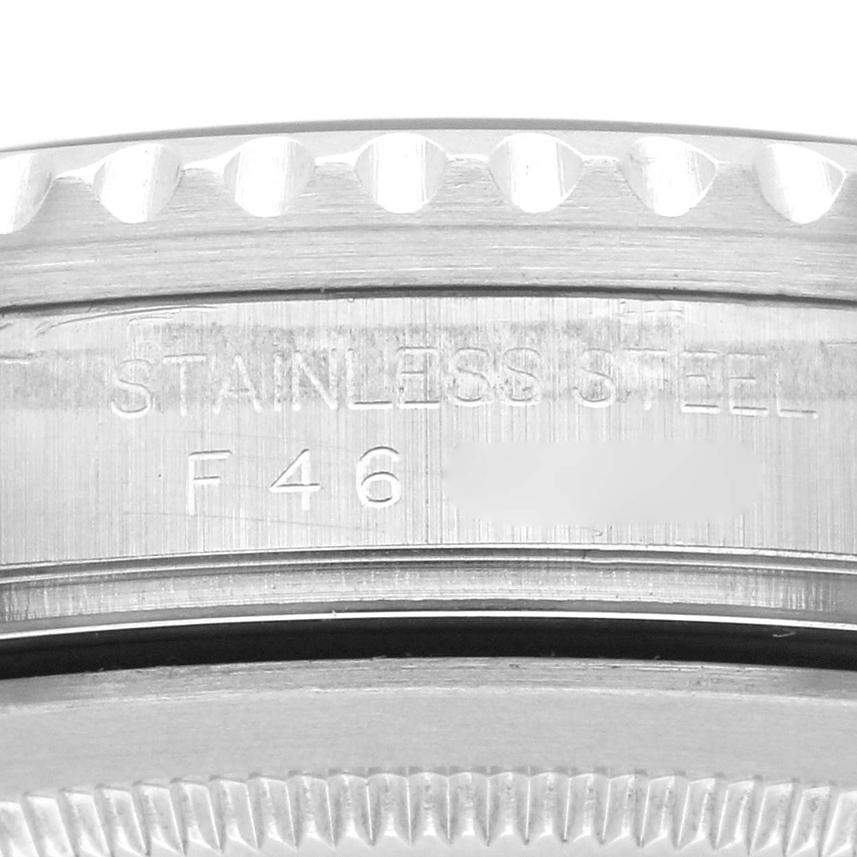 The image shows a close-up of the side engraving on a Rolex GMT-Master 16710 Men
s Stainless Steel Black Dial 16710 Men
s Stainless Steel Black Dial watch, highlighting its stainless steel material.