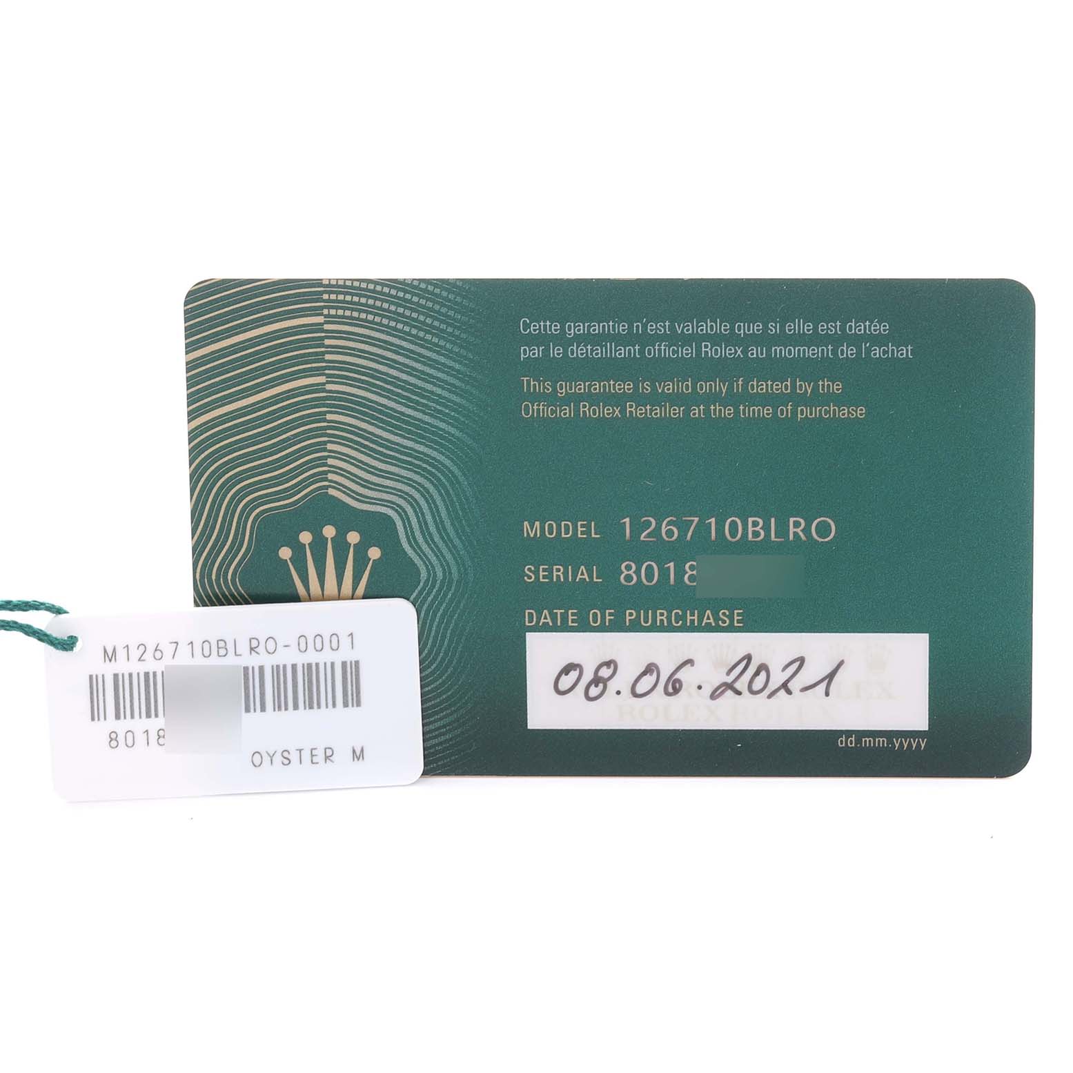 The image shows the guarantee card and tag for a Rolex GMT-Master 126710BLRO Men's Stainless Steel Black Dial, model 126710BLRO, with the date of purchase visible.