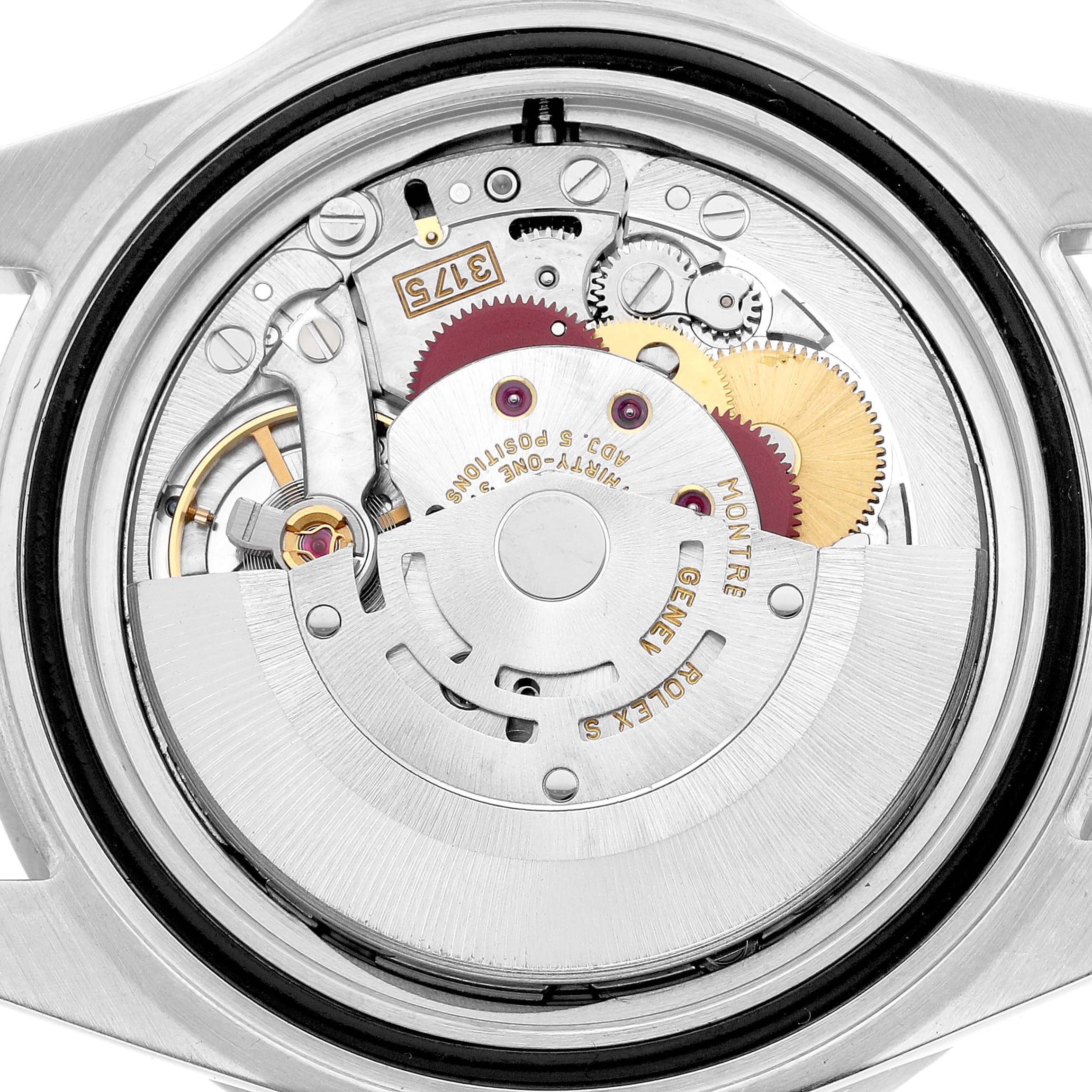 The image shows the back view of a Rolex GMT-Master 16700 Men's Stainless Steel Black Dial, highlighting its intricate movement and gears.