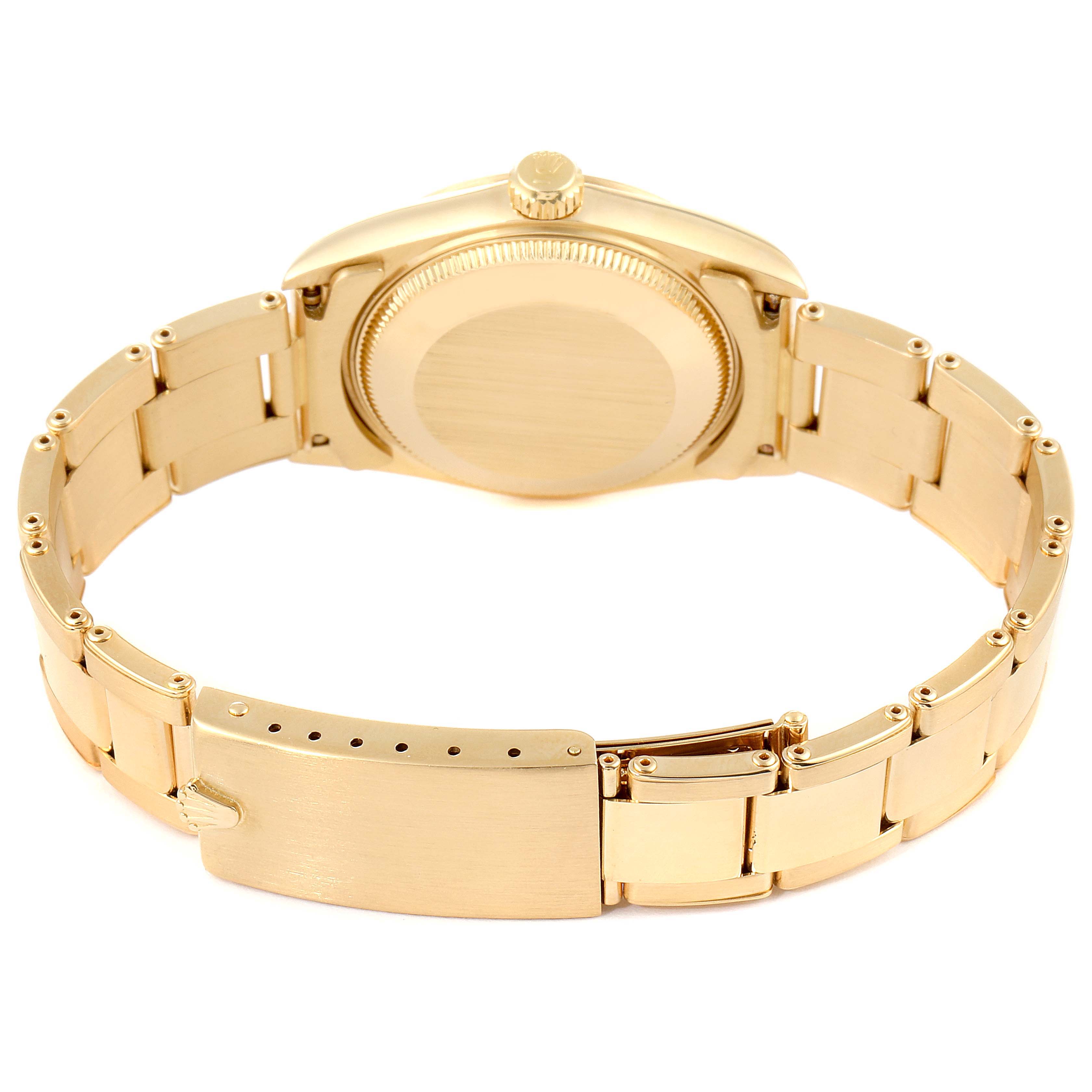 This image shows the back casing and bracelet of a Rolex President 67488 Women
s Yellow Gold White Dial 67488 Women
s Yellow Gold White Dial model watch from a rear angle.