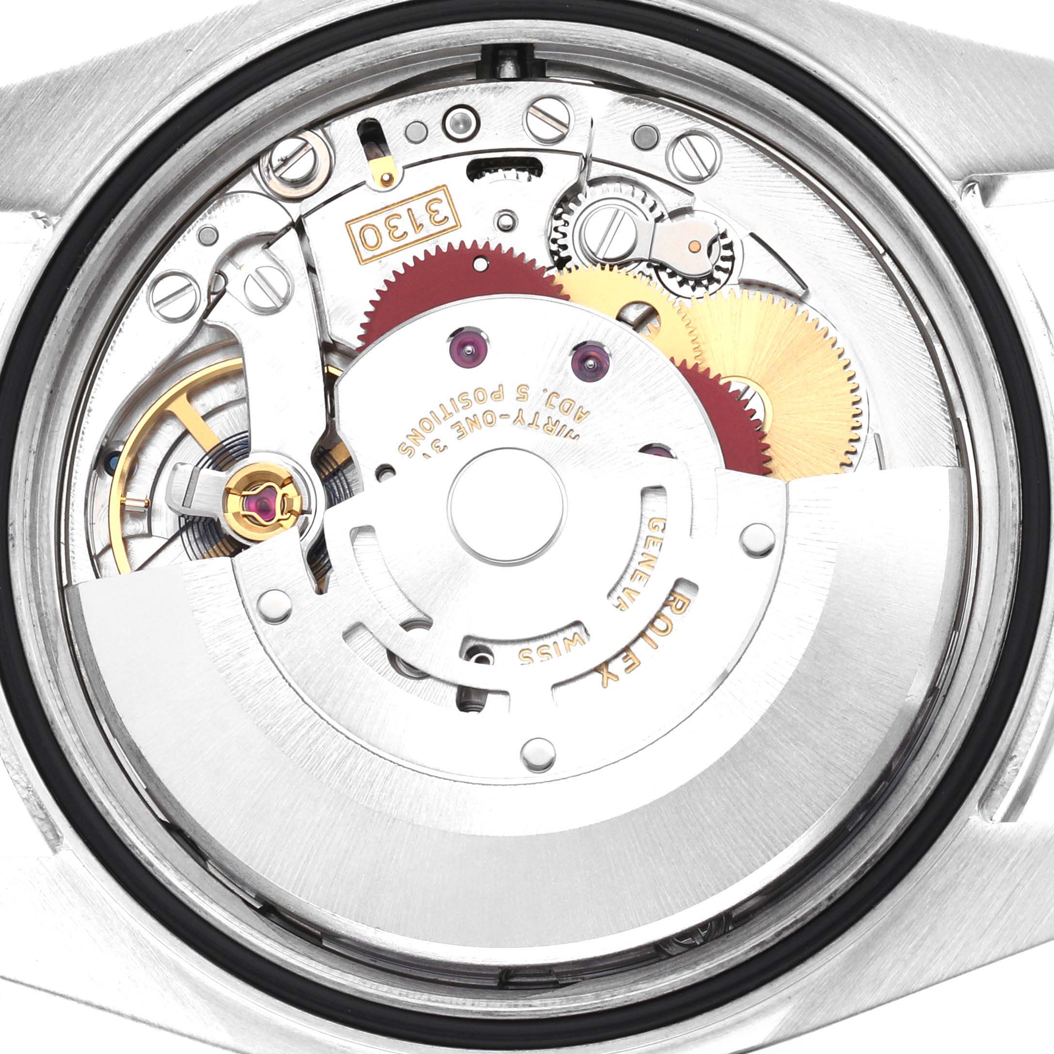 The image shows a close-up view of the Rolex Oyster Perpetual 116000 Men's Stainless Steel Silver Dial's movement, highlighting gears and the oscillating weight.