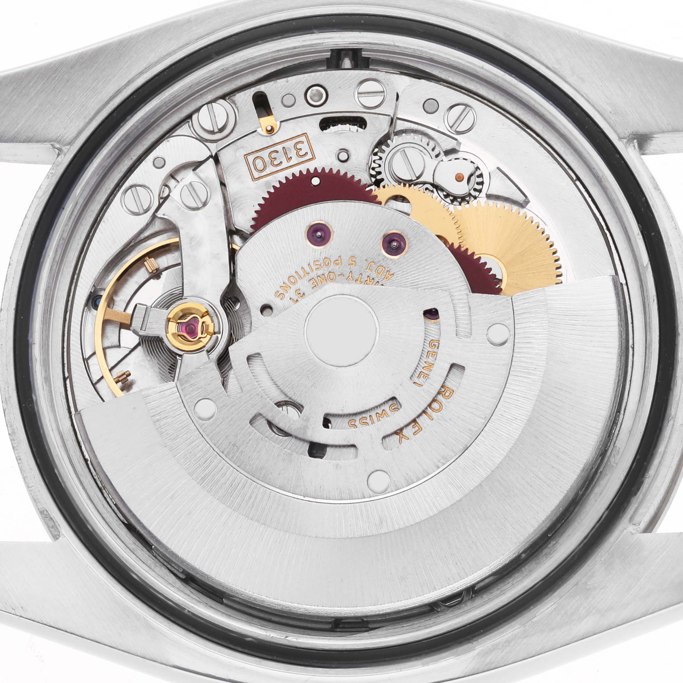 The image shows the internal mechanism of a Rolex Oyster Perpetual 116034 Men's Stainless Steel White Dial watch viewed from the back, highlighting gears and inscriptions.