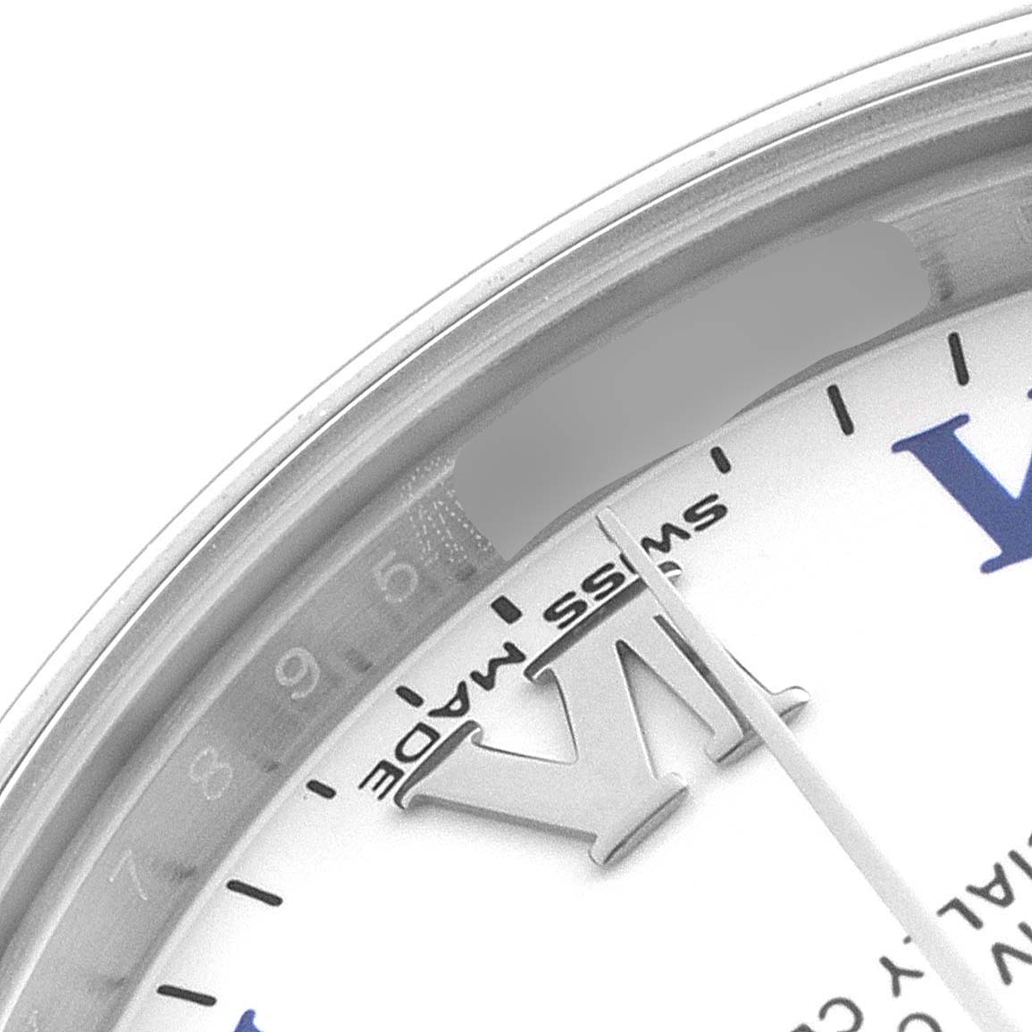 The image shows a close-up of the dial and bezel from the Mid-Size Rolex watch at an angle focusing on the "VI" Roman numeral and "Swiss Made" text.