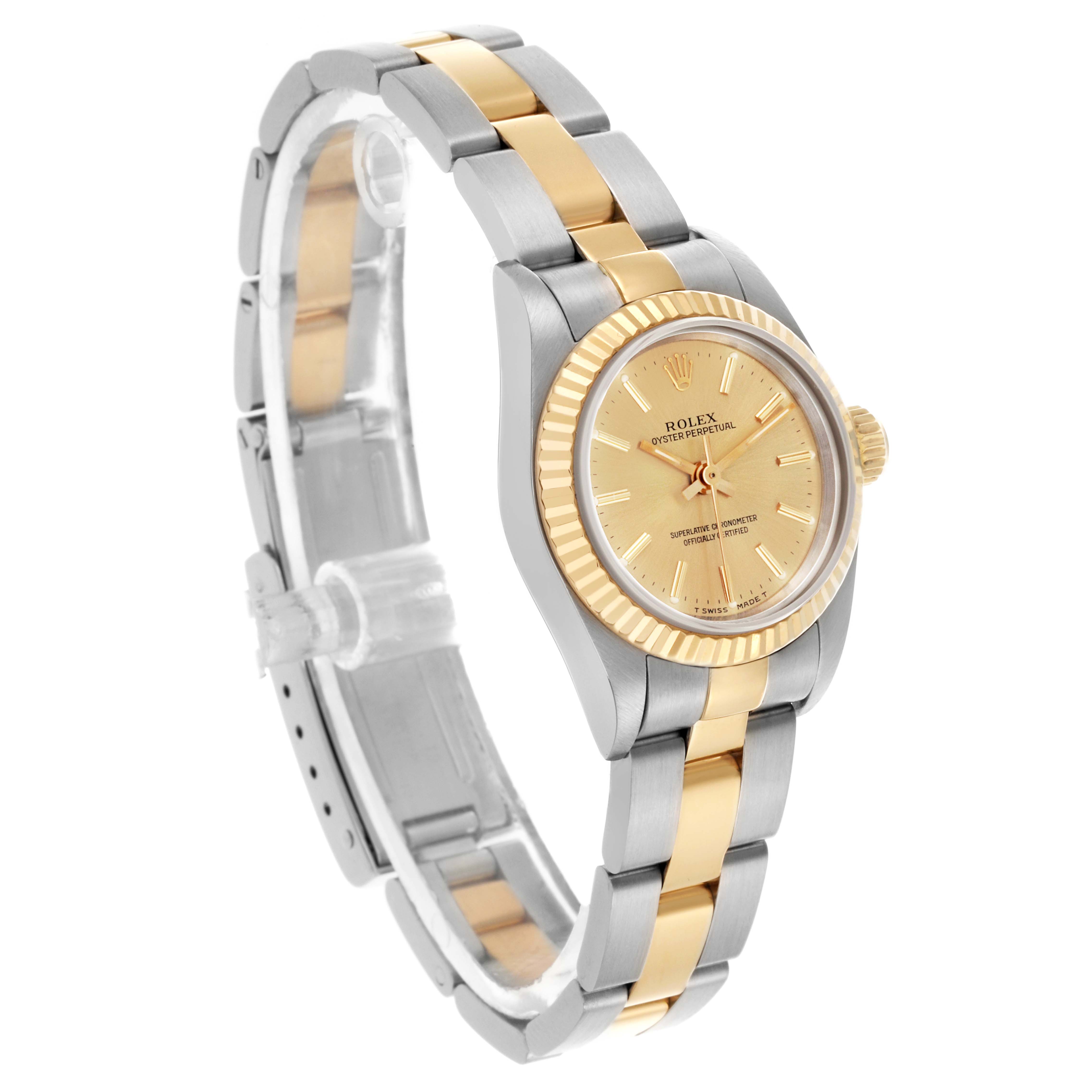 The Rolex Oyster Perpetual 67193 Women's Steel and Gold (two tone) Champagne Dial 67193 Women's Steel and Gold (two tone) Champagne Dial watch is shown at a three-quarter angle, displaying the dial, bezel, and bracelet.