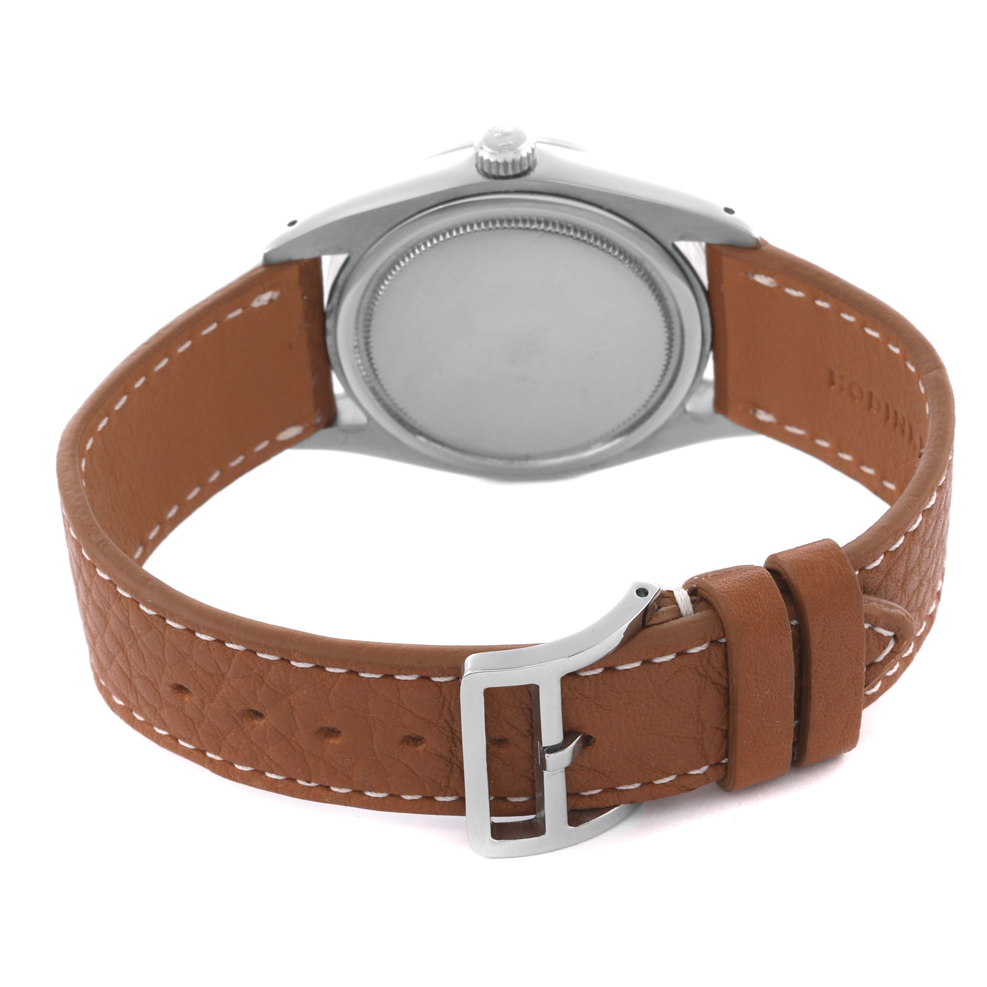 The Rolex Vintage Collection 6694 Men's Stainless Steel Black Dial 6694 Men's Stainless Steel Black Dial watch is shown from the back, highlighting the leather strap and buckle.