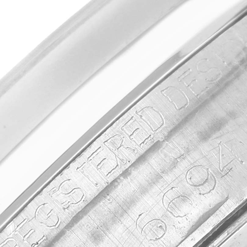 The image shows an angled close-up of the engraved reference numbers on the Rolex Vintage Collection 6694 Men's Stainless Steel Black Dial 6694 Men's Stainless Steel Black Dial watch.