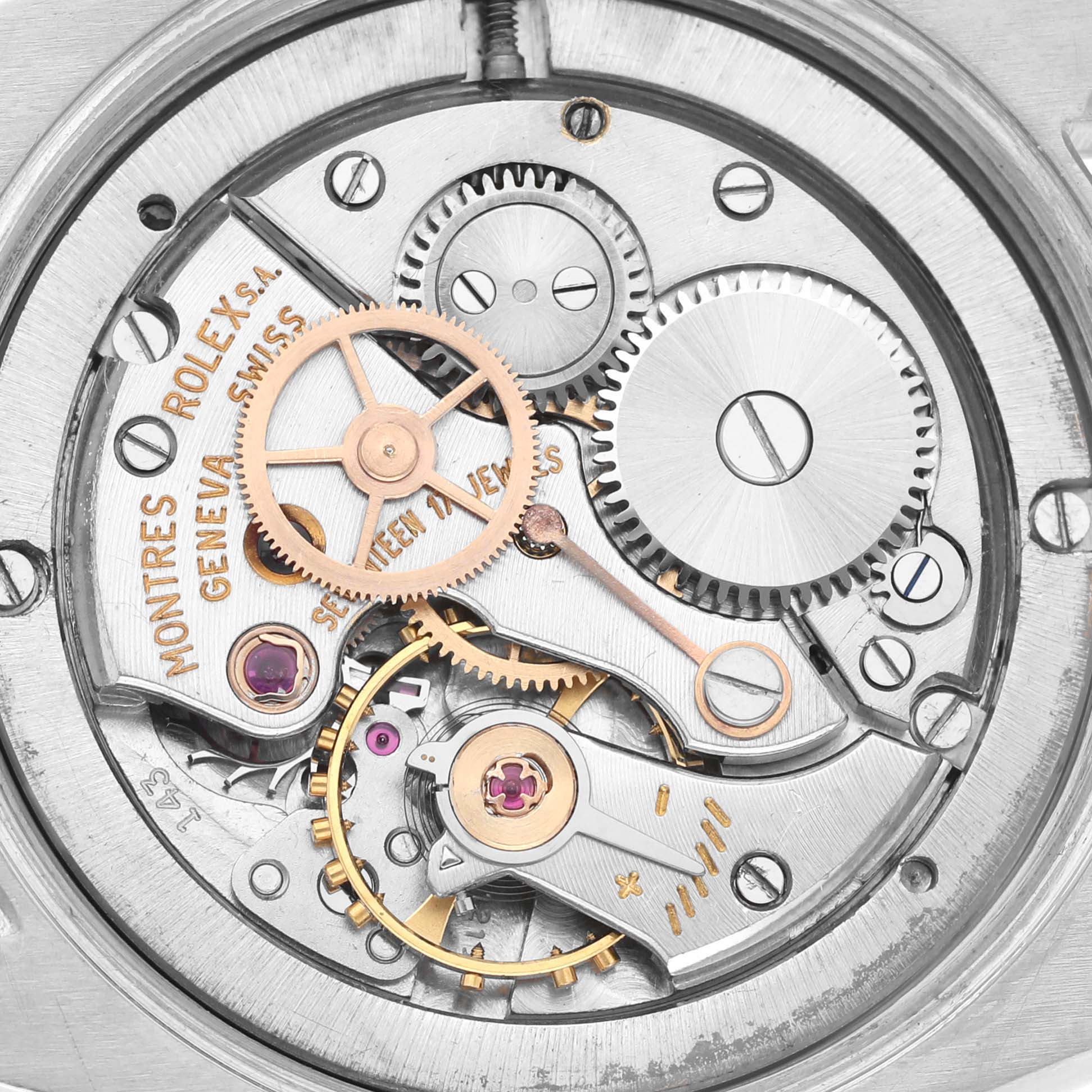 The image shows the intricate movement inside the Rolex Vintage Collection 6694 Men's Stainless Steel Black Dial 6694 Men's Stainless Steel Black Dial watch, highlighting gears and mechanical components.