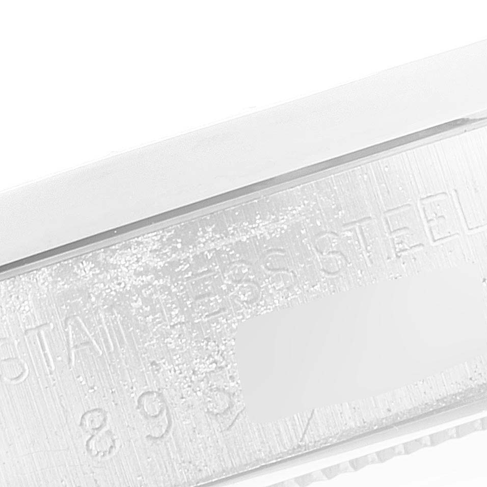 This image shows a close-up of the stainless steel case and serial number engraving on a Rolex Vintage Collection 6694 Men
s Stainless Steel Silver Dial 6694 Men
s Stainless Steel Silver Dial model watch.