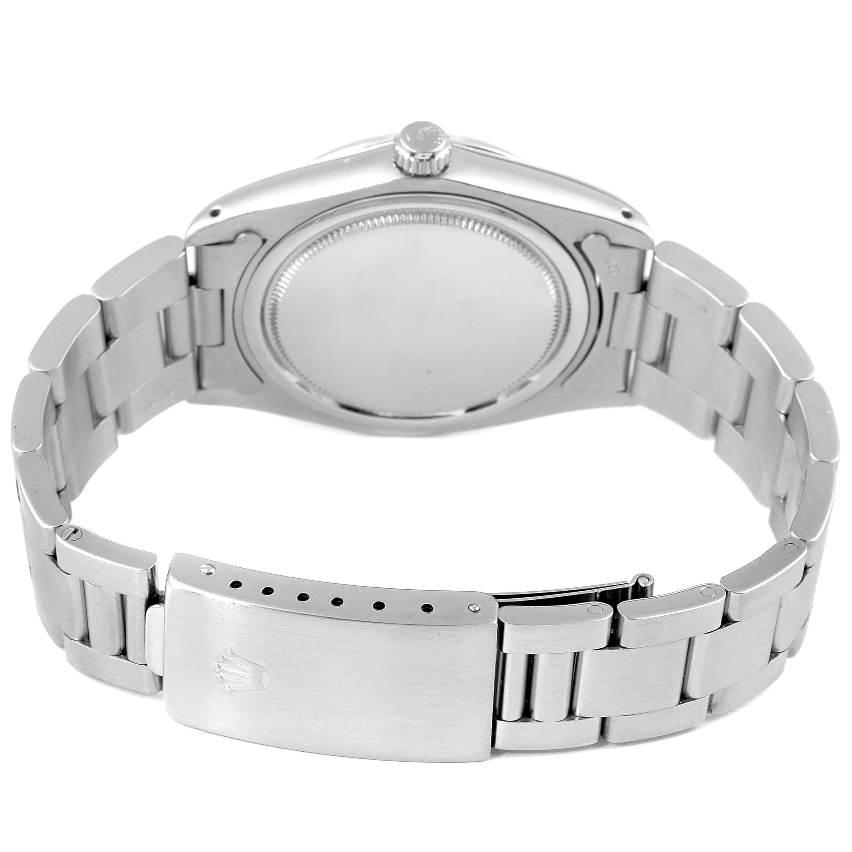 The image shows the back view of a Rolex Vintage Collection 6694 Men
s Stainless Steel Silver Dial 6694 Men
s Stainless Steel Silver Dial model, highlighting the caseback, bracelet, and clasp.