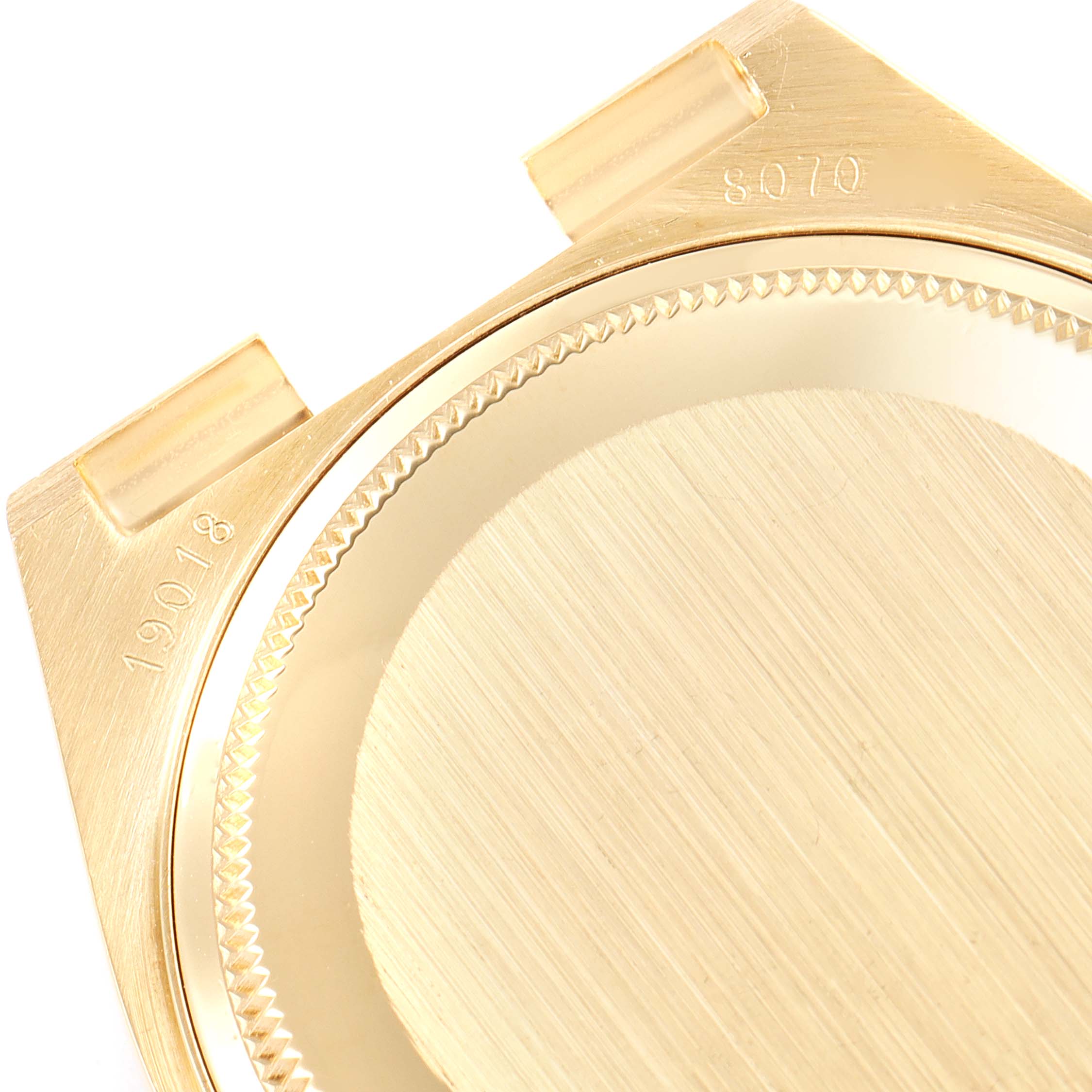 This image shows a close-up of the back case of a Rolex President 19018 Men
s Yellow Gold Champagne Dial 19018 Men
s Yellow Gold Champagne Dial model watch, highlighting the lugs and part numbers.