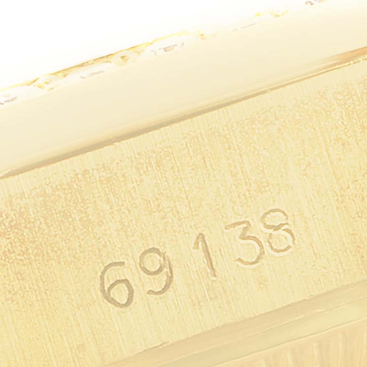 This close-up image shows the engraved model number "69138" on the side of the Rolex President 69138 Women
s Yellow Gold Champagne Dial 69138 Women
s Yellow Gold Champagne Dial watch.