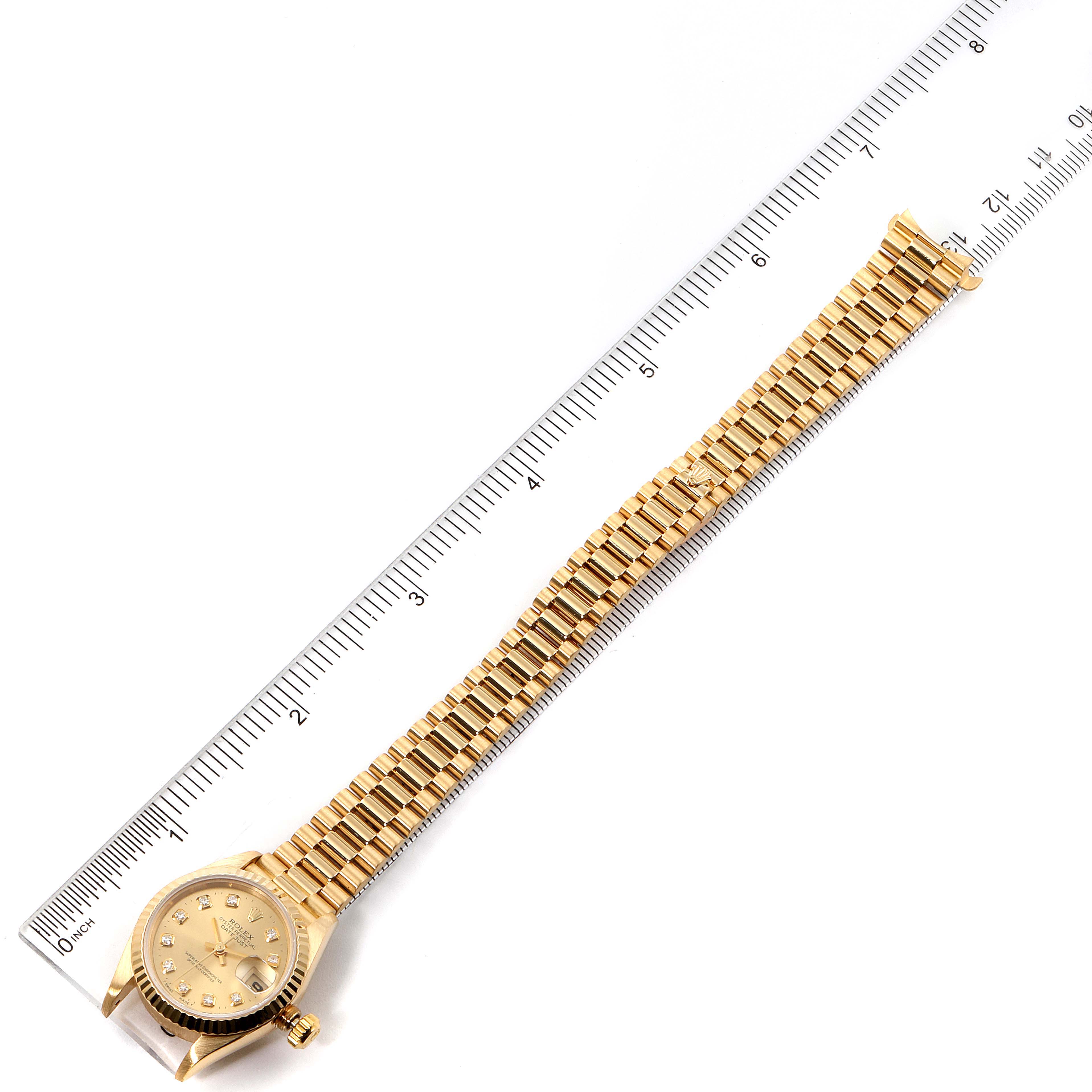 The Rolex President 69178 Women
s Yellow Gold Champagne Dial 69178 Women
s Yellow Gold Champagne Dial model watch is shown from a top-down angle, displaying its full bracelet, case, and dial.