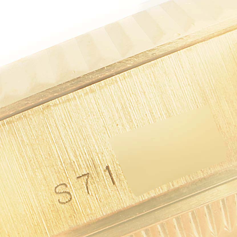 This image shows a close-up of the side casing with serial engraving on a Rolex President 69178 Women
s Yellow Gold Champagne Dial 69178 Women
s Yellow Gold Champagne Dial model watch.