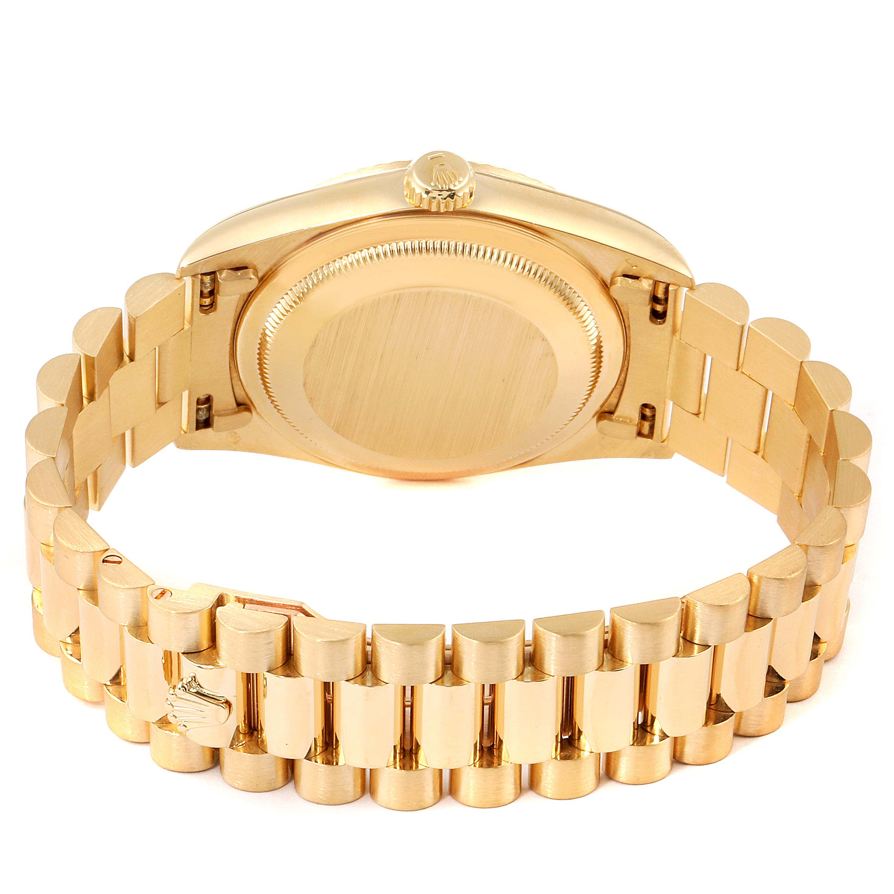 The image shows the rear side of the Rolex President 18238 Men
s Yellow Gold Champagne Dial 18238 Men
s Yellow Gold Champagne Dial watch, focusing on its gold case back and bracelet.