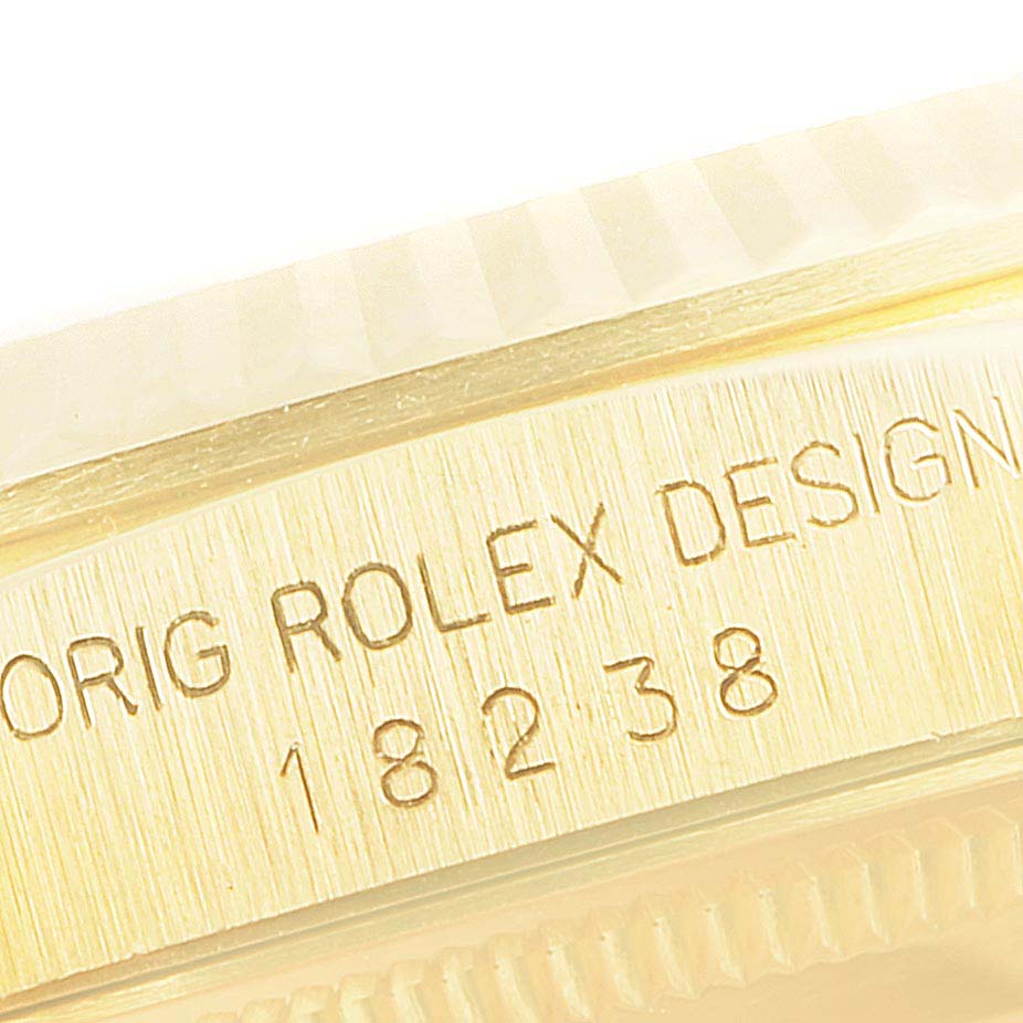 This close-up image shows the engraved side of a Rolex President 18238 Men's Yellow Gold Champagne Dial 18238 Men's Yellow Gold Champagne Dial model watch case, indicating the model number 18238.