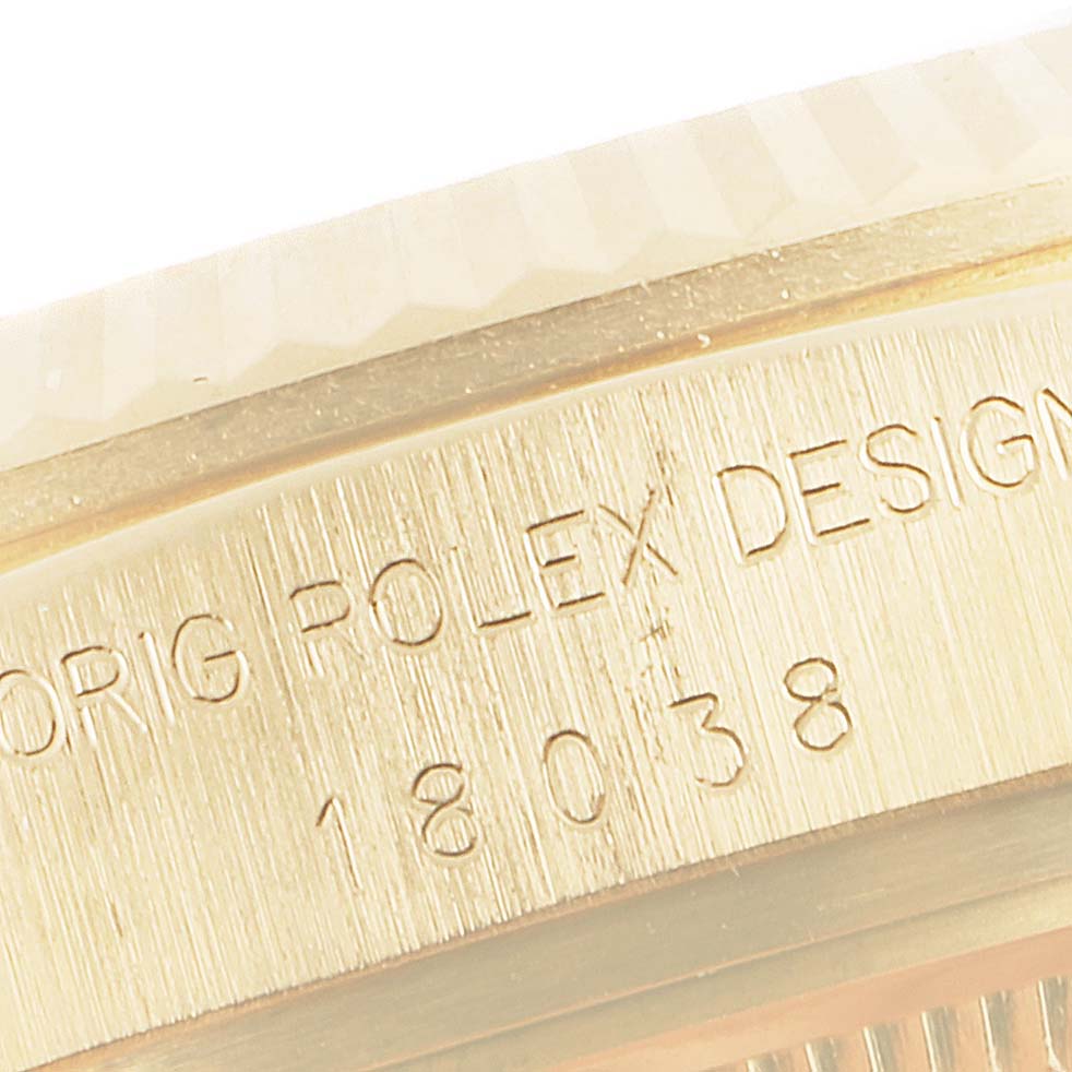 This close-up image shows the engraved edge of the President model by Rolex, highlighting the design and model number.