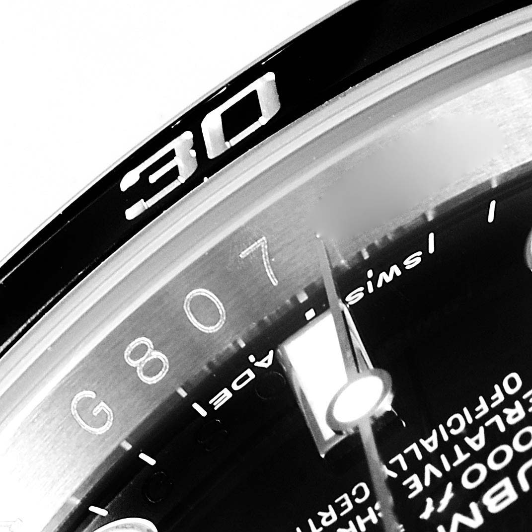 This image shows a close-up of the bezel and dial, including the "30" marker, of the Rolex Submariner 114060 Men
s Stainless Steel Black Dial 114060 Men
s Stainless Steel Black Dial watch.