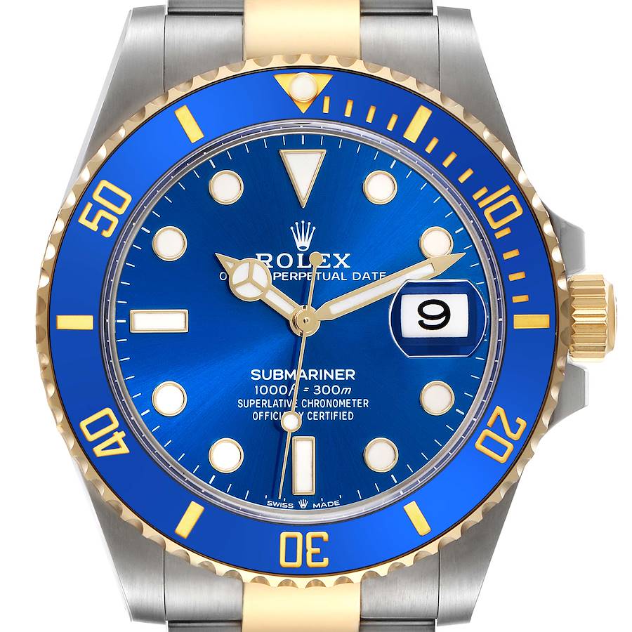 The image shows a front view of the Rolex Submariner, displaying the blue dial, bezel, crown, and part of the bracelet.