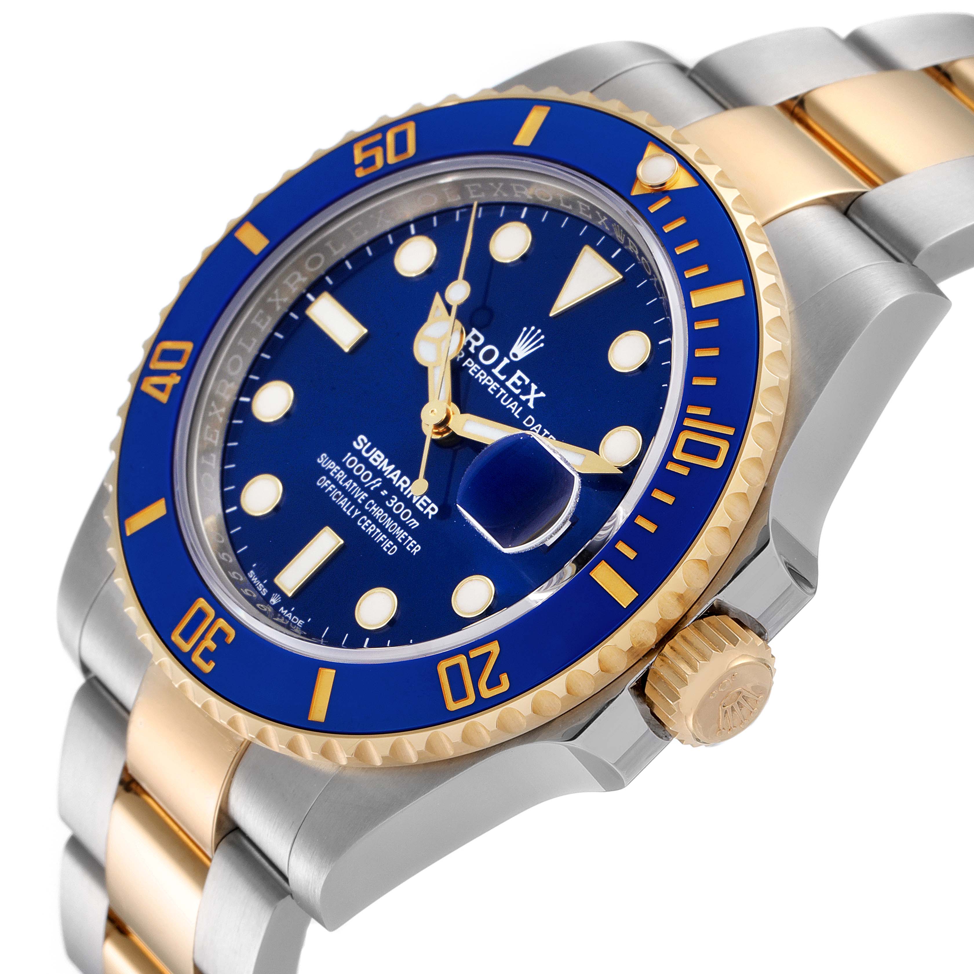 The image shows a close-up angled view of a Rolex Submariner 126613 Men's Steel and Gold (two tone) Blue Dial 126613 Men's Steel and Gold (two tone) Blue Dial, highlighting its blue dial, gold bezel, and stainless steel-gold bracelet.