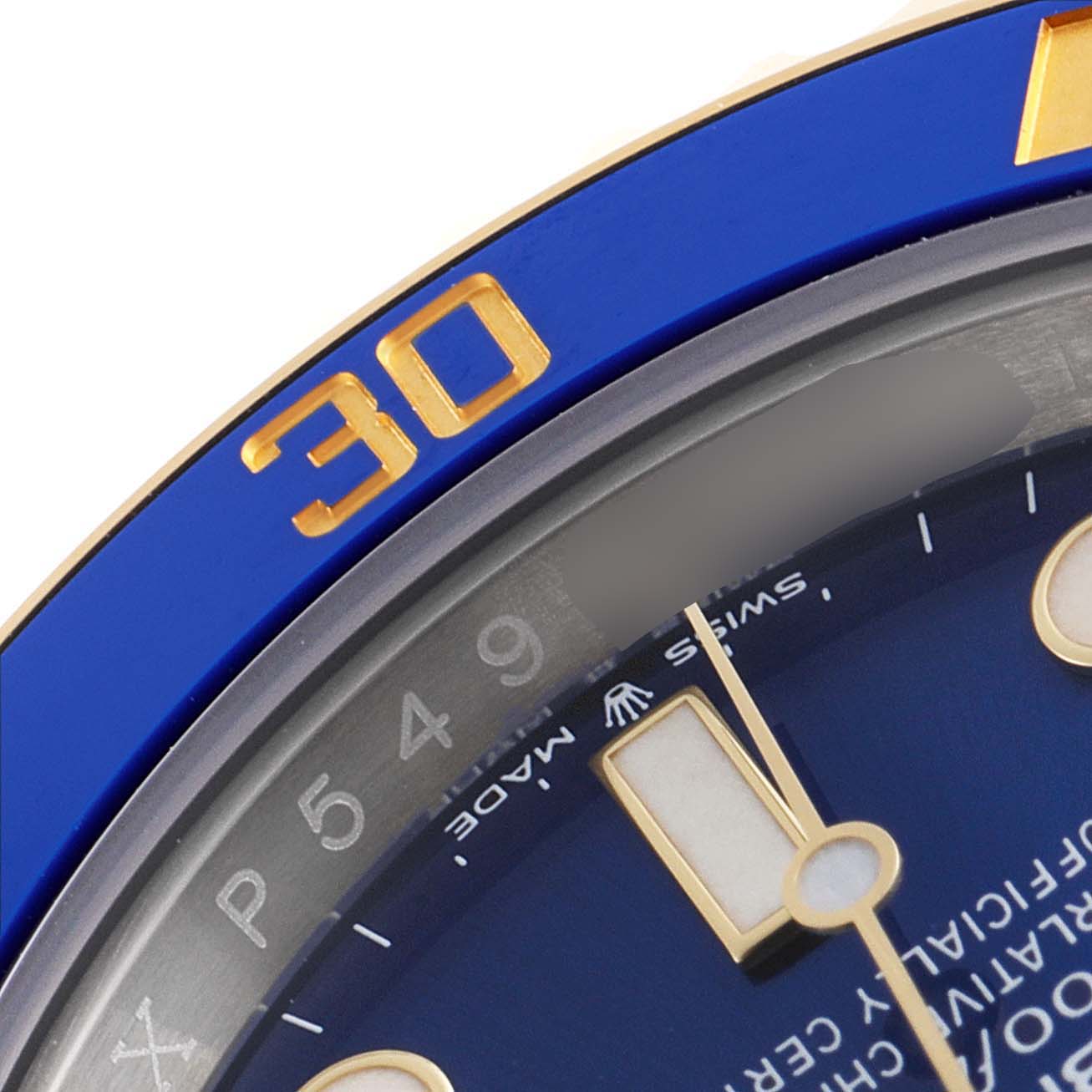 This image shows a close-up of the bezel and dial of a Rolex Submariner 126613 Men's Steel and Gold (two tone) Blue Dial 126613 Men's Steel and Gold (two tone) Blue Dial watch, focusing on the 30-minute marker.