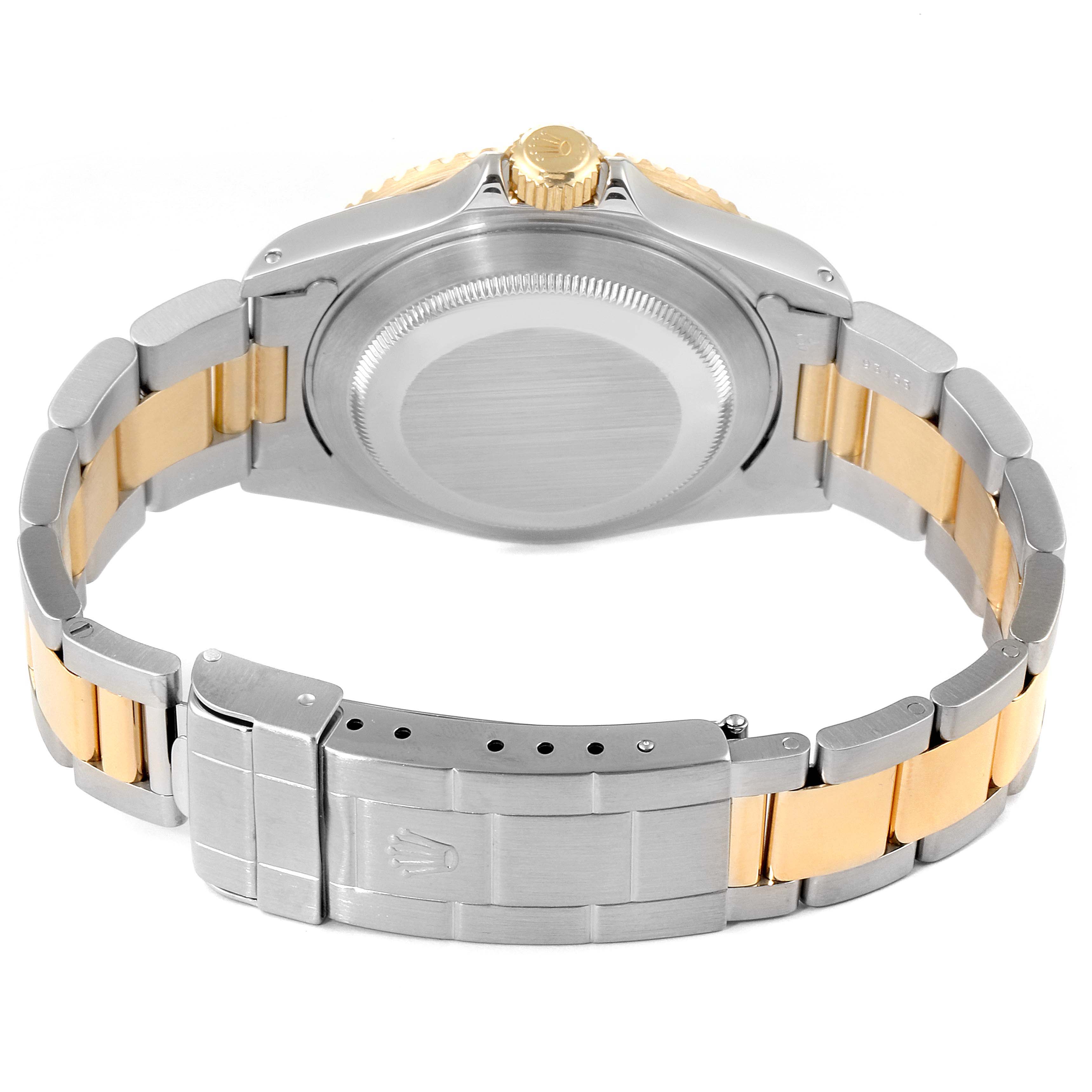 The image shows the back of a Rolex Submariner 16613 Men's Steel and Gold (two tone) Blue Dial 16613 Men's Steel and Gold (two tone) Blue Dial watch, featuring the case back, crown, and two-tone bracelet.