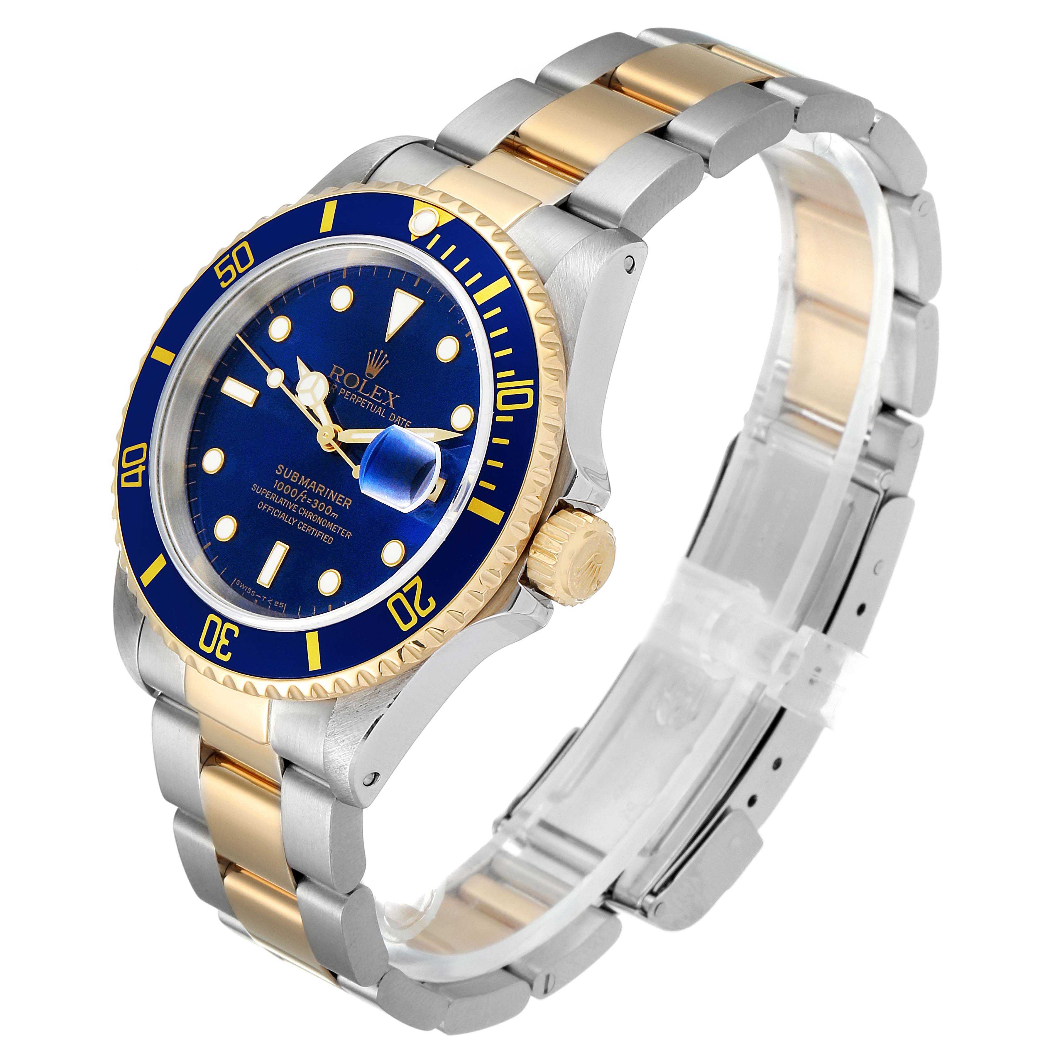 The Rolex Submariner 16613 Men's Steel and Gold (two tone) Blue Dial 16613 Men's Steel and Gold (two tone) Blue Dial watch is shown at an angle displaying its blue face, gold bezel, and bi-metal bracelet in silver and gold.