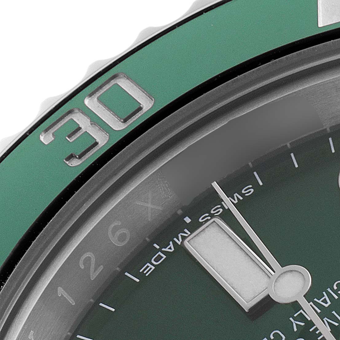 Close-up of a Rolex Submariner 116610LV Men
s Stainless Steel Green Dial 116610LV Men
s Stainless Steel Green Dial, showing part of the green bezel, the 30-minute marker, and partial green dial with minute hand.