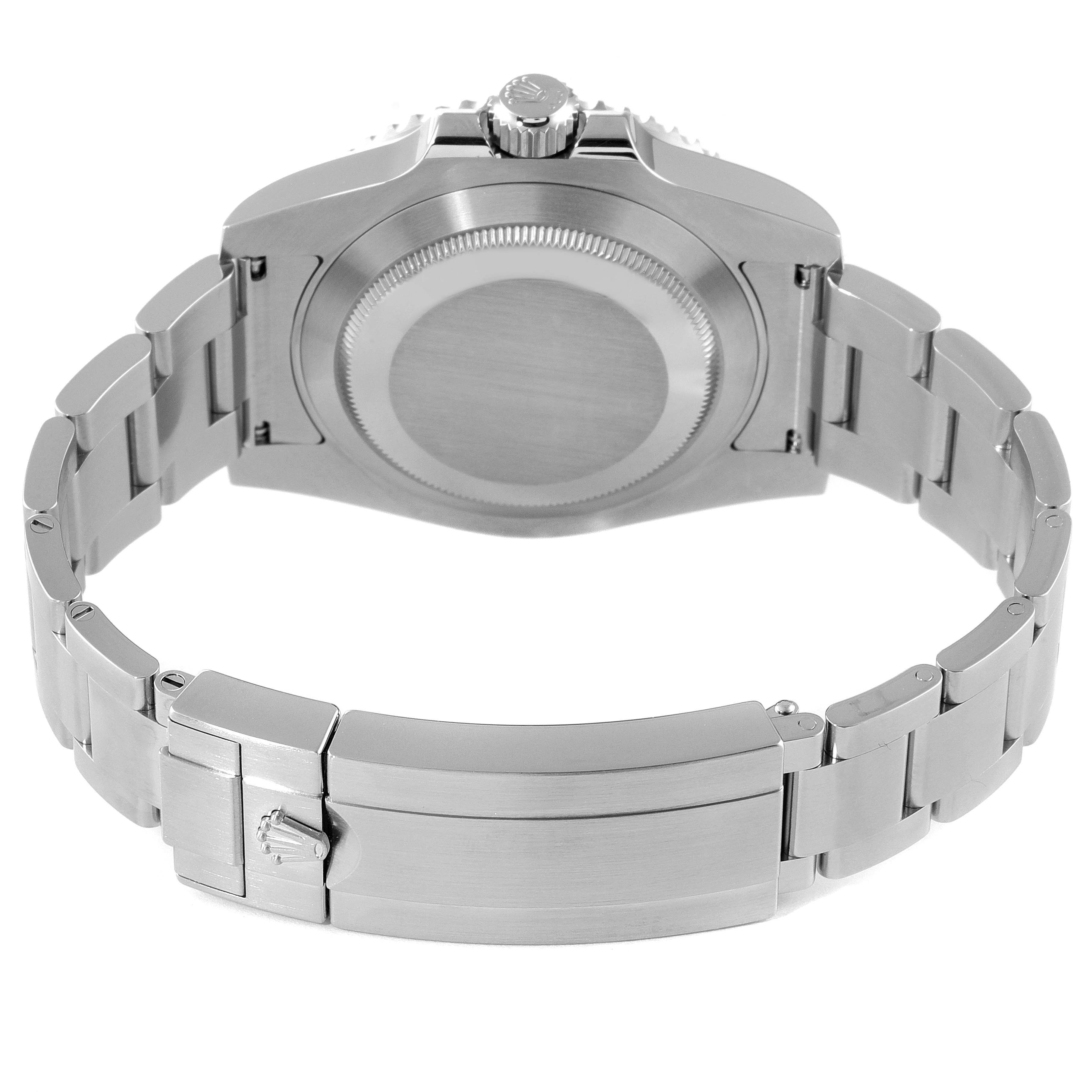 The image shows the back view of a Rolex Submariner 116610LV Men
s Stainless Steel Green Dial 116610LV Men
s Stainless Steel Green Dial watch, highlighting the case back and the clasp with the bracelet fully extended.