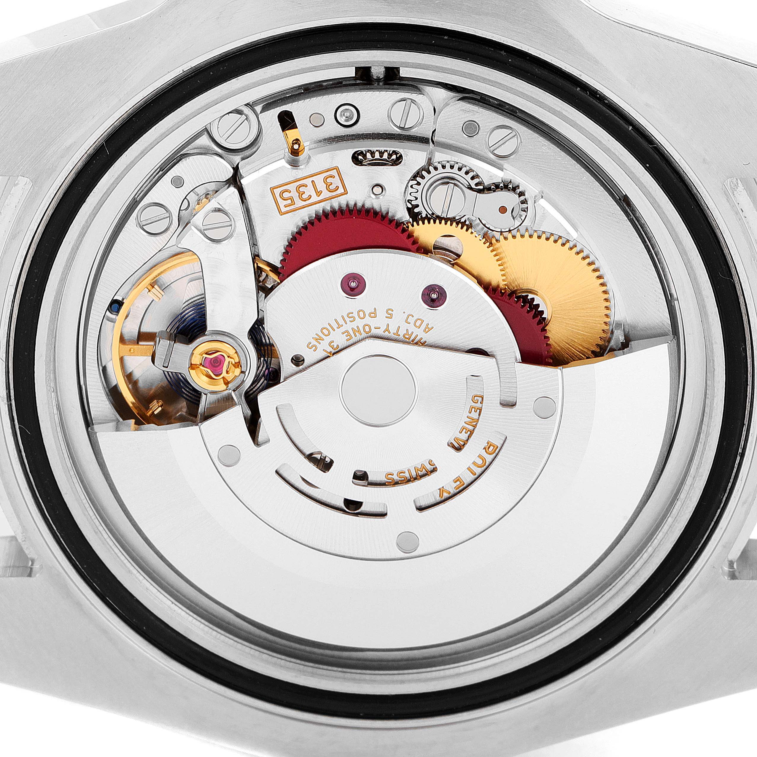 The image shows the internal mechanical movement of a Rolex Submariner 116610LV Men
s Stainless Steel Green Dial 116610LV Men
s Stainless Steel Green Dial watch from a rear angle.