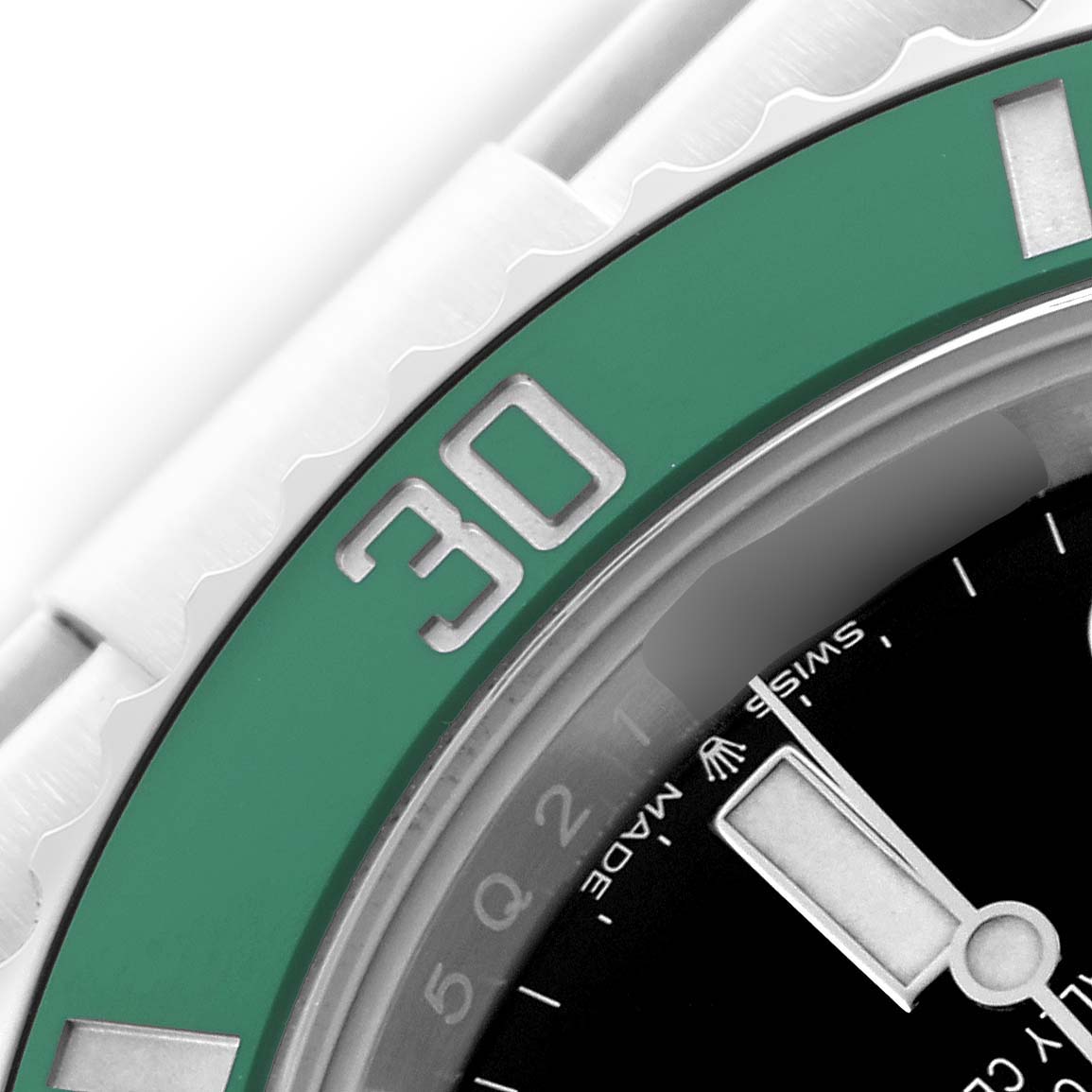 The image shows a close-up angle of the Rolex Submariner 126610LV Men's Stainless Steel Black Dial's green bezel and part of the black dial with hour markers.