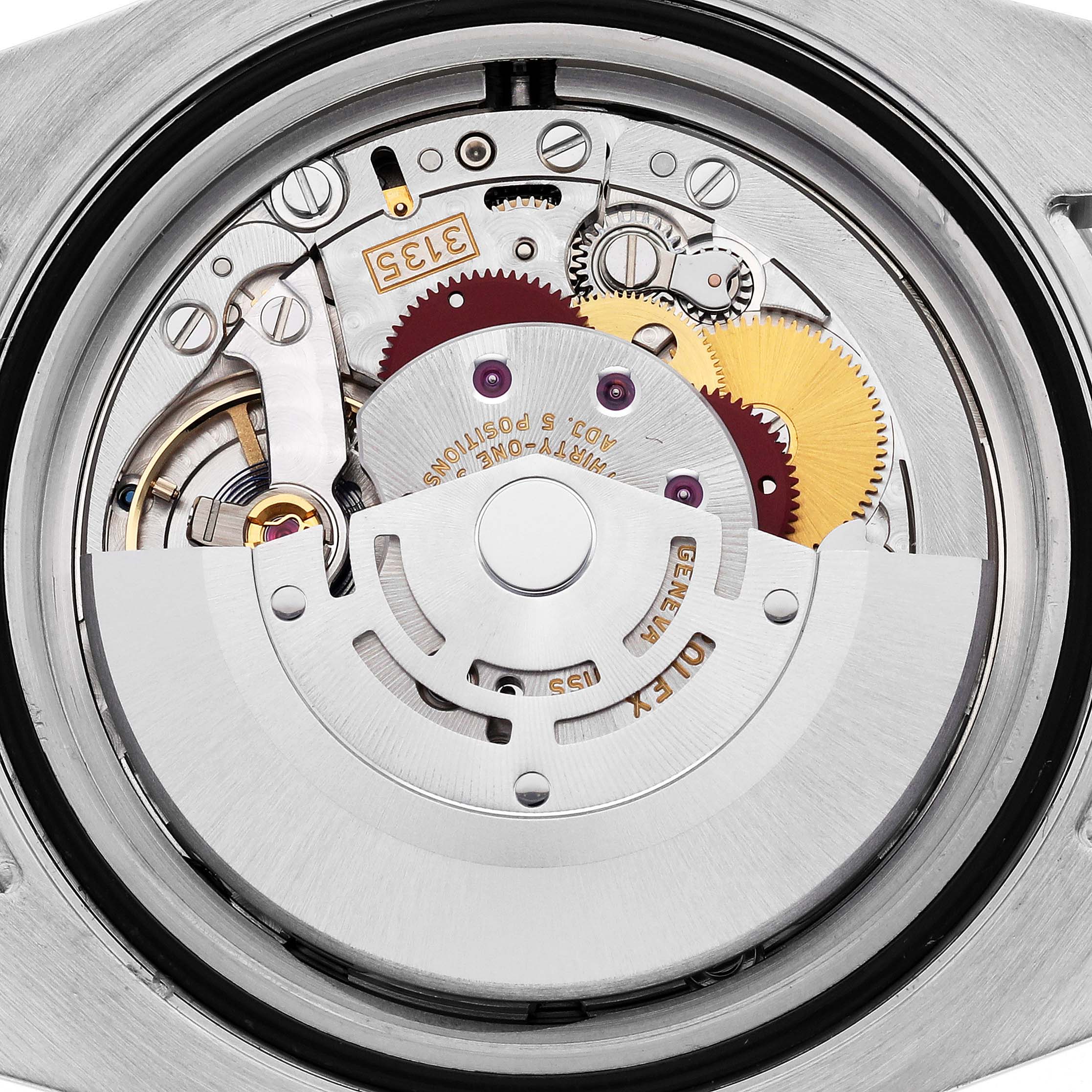 The image shows the back view of the Rolex Submariner 116613LN Men's Steel and Gold (two tone) Black Dial 116613LN Men's Steel and Gold (two tone) Black Dial, revealing its intricate movement components.