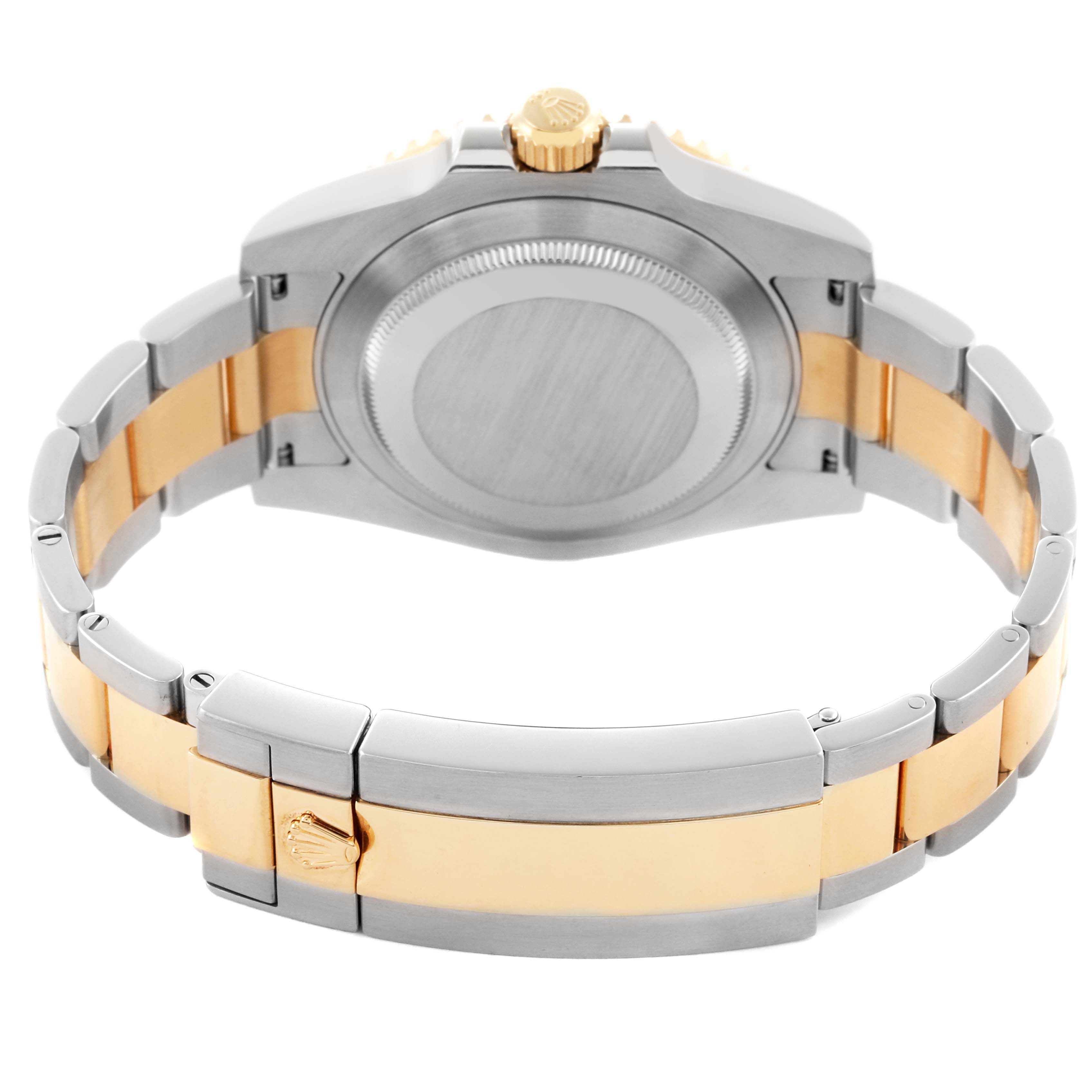 This Rolex Submariner 116613LN Men's Steel and Gold (two tone) Black Dial 116613LN Men's Steel and Gold (two tone) Black Dial is shown from a rear angle, highlighting the case back and two-tone bracelet.