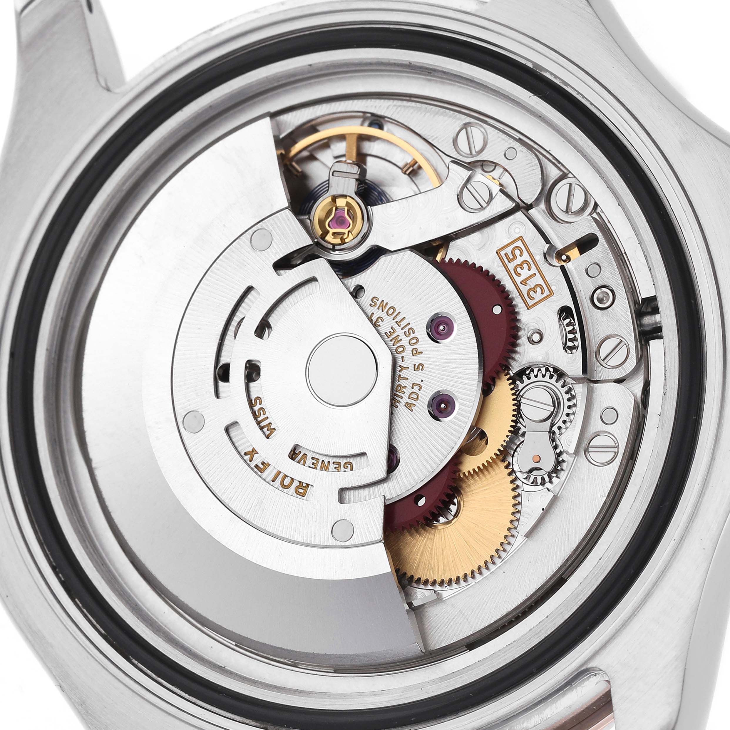 The image shows the movement of a Rolex Yacht-Master 116621 Men's Steel and Gold (two tone) Brown Dial watch from a rear angle, highlighting its intricate mechanical components.