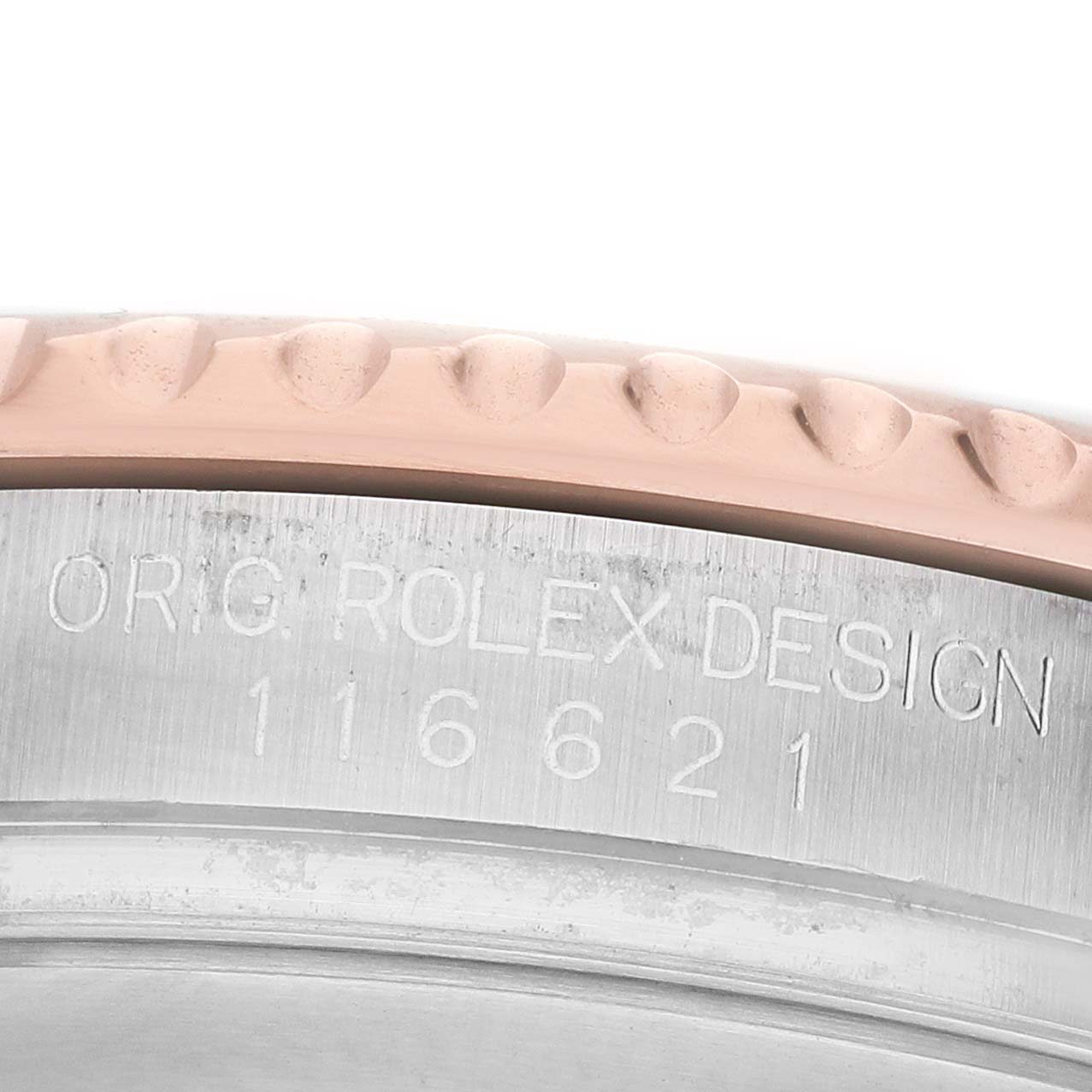 The image shows a close-up of the engraved bezel of a Rolex Yacht-Master 116621 Men's Steel and Gold (two tone) Brown Dial watch.