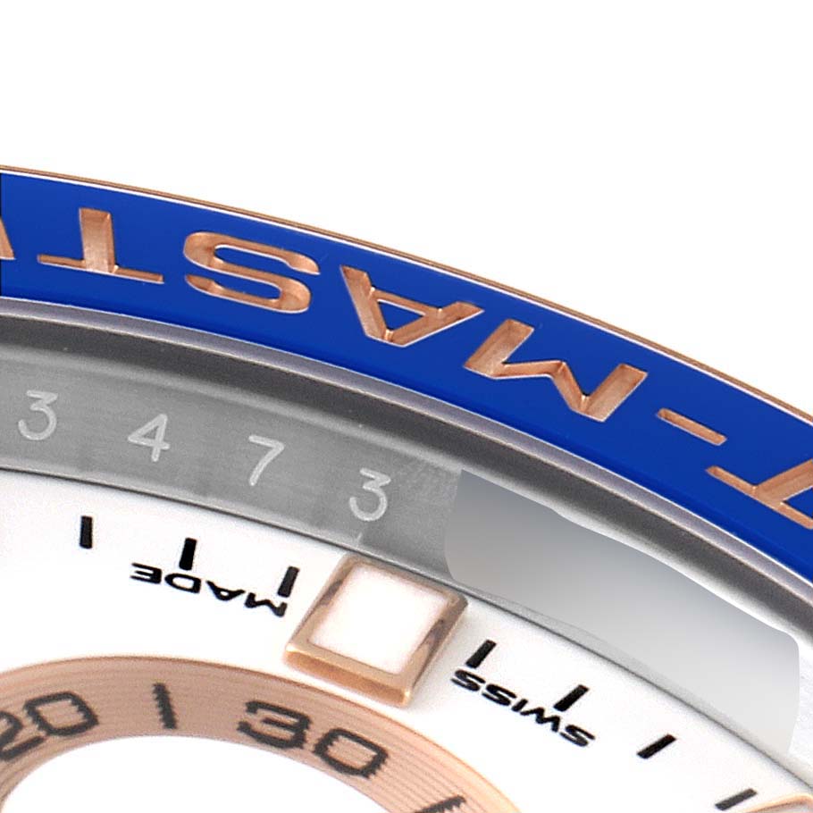 The image shows a close-up angle of the bezel and part of the dial of the Rolex Yacht-Master 116681 Men's Steel and Gold (two tone) White Dial 116681 Men's Steel and Gold (two tone) White Dial watch.