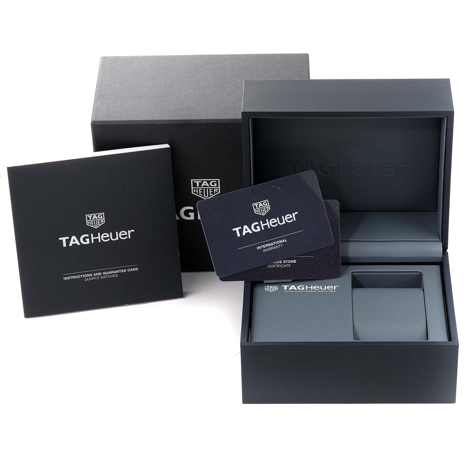 The image shows the open box, international warranty card, and instruction manual for the Tag Heuer Aquaracer WAY1311 Women's Stainless Steel Mother of Pearl Dial WAY1311 Women's Stainless Steel Mother of Pearl Dial model.