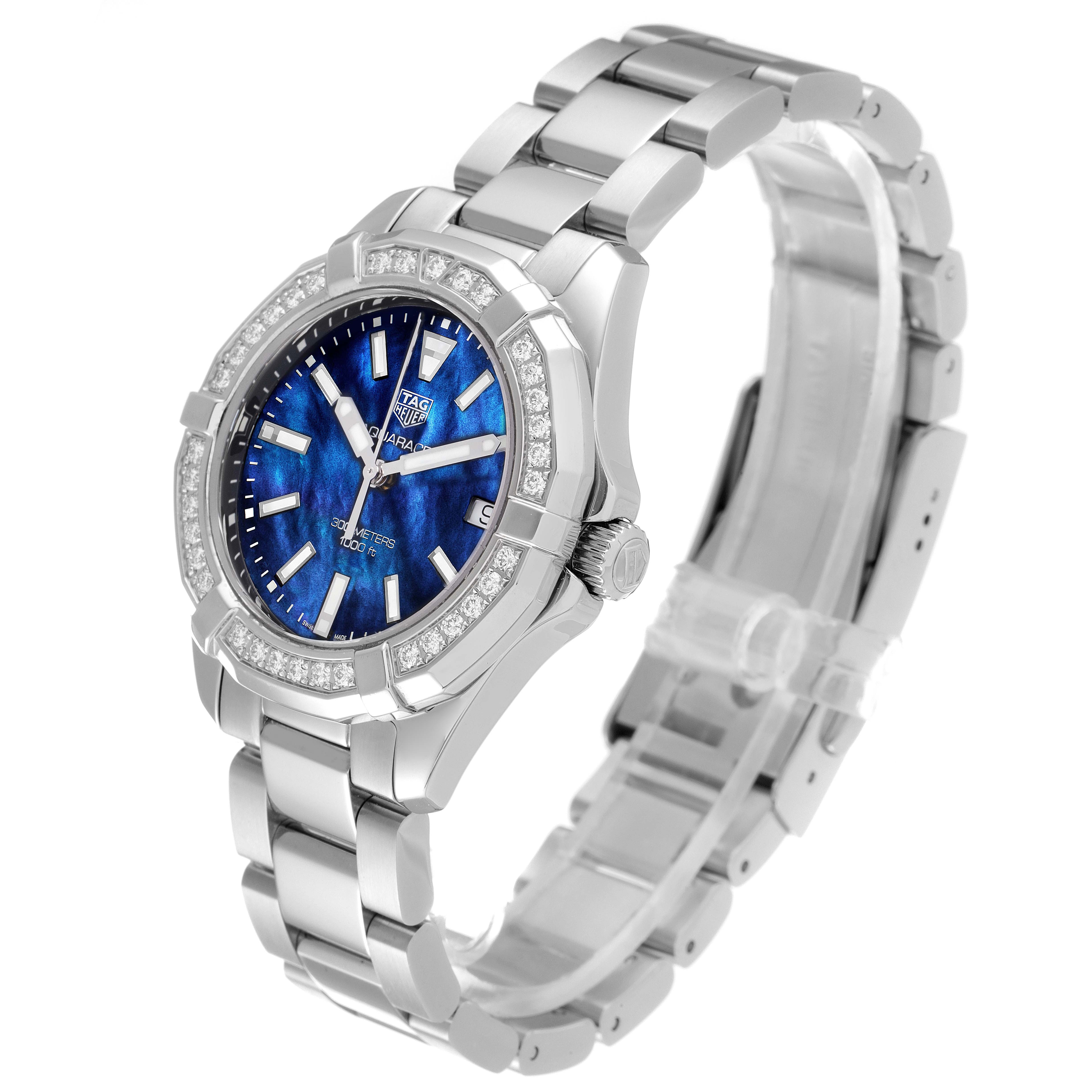 The Tag Heuer Aquaracer WAY1311 Women's Stainless Steel Mother of Pearl Dial WAY1311 Women's Stainless Steel Mother of Pearl Dial watch is shown at an angle, displaying its blue dial, diamond bezel, and stainless steel bracelet.