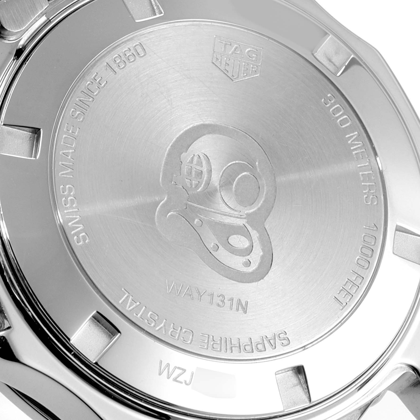 The image displays the case back of a Tag Heuer Aquaracer WAY1311 Women's Stainless Steel Mother of Pearl Dial WAY1311 Women's Stainless Steel Mother of Pearl Dial watch, showcasing engravings such as "Swiss Made," "300 Meters," and a diving helmet.
