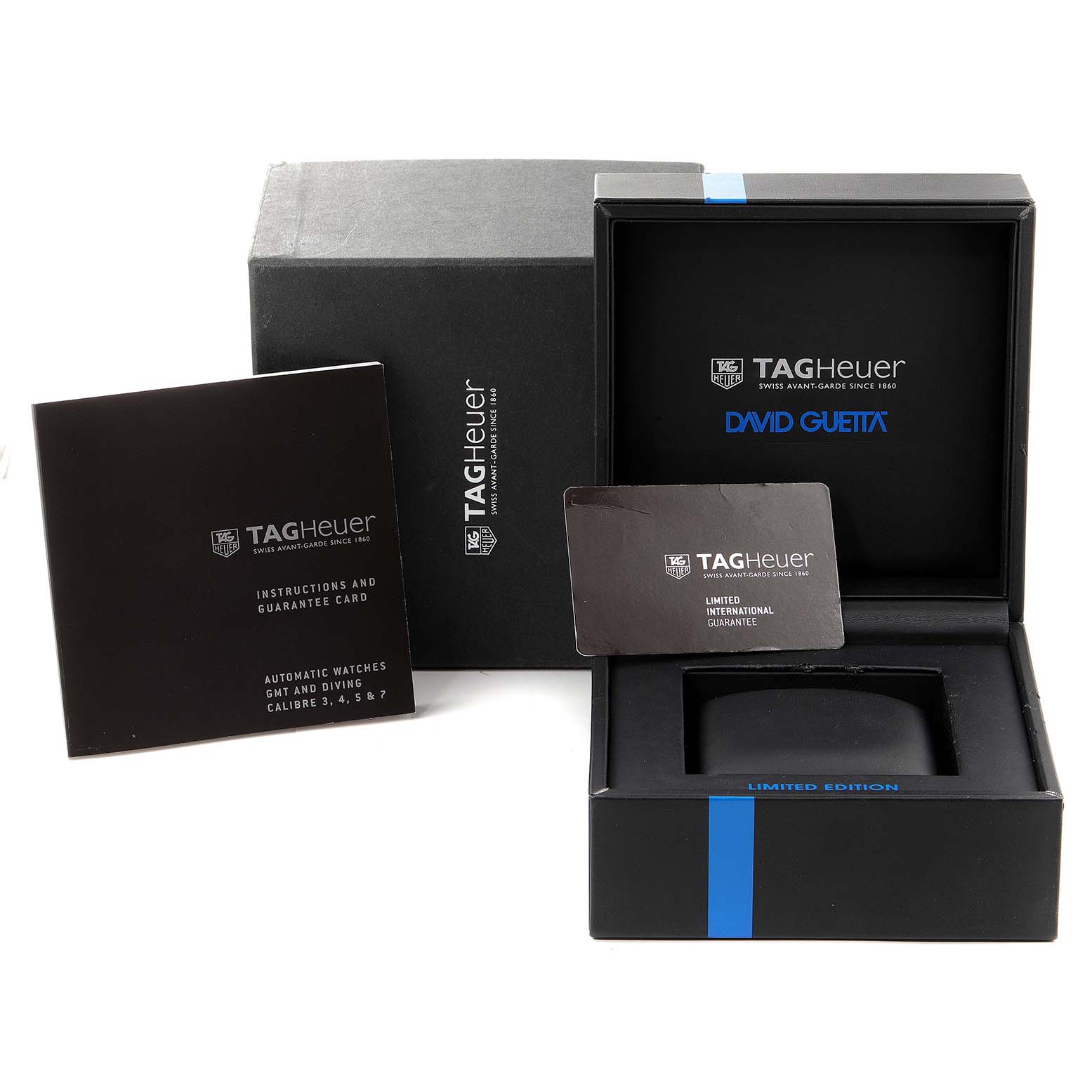 The image shows the packaging, instruction booklet, and guarantee card for a Tag Heuer Formula 1 WAZ201A.FC8195 Men's Titanium Black Dial WAZ201A.FC8195 Men's Titanium Black Dial watch.