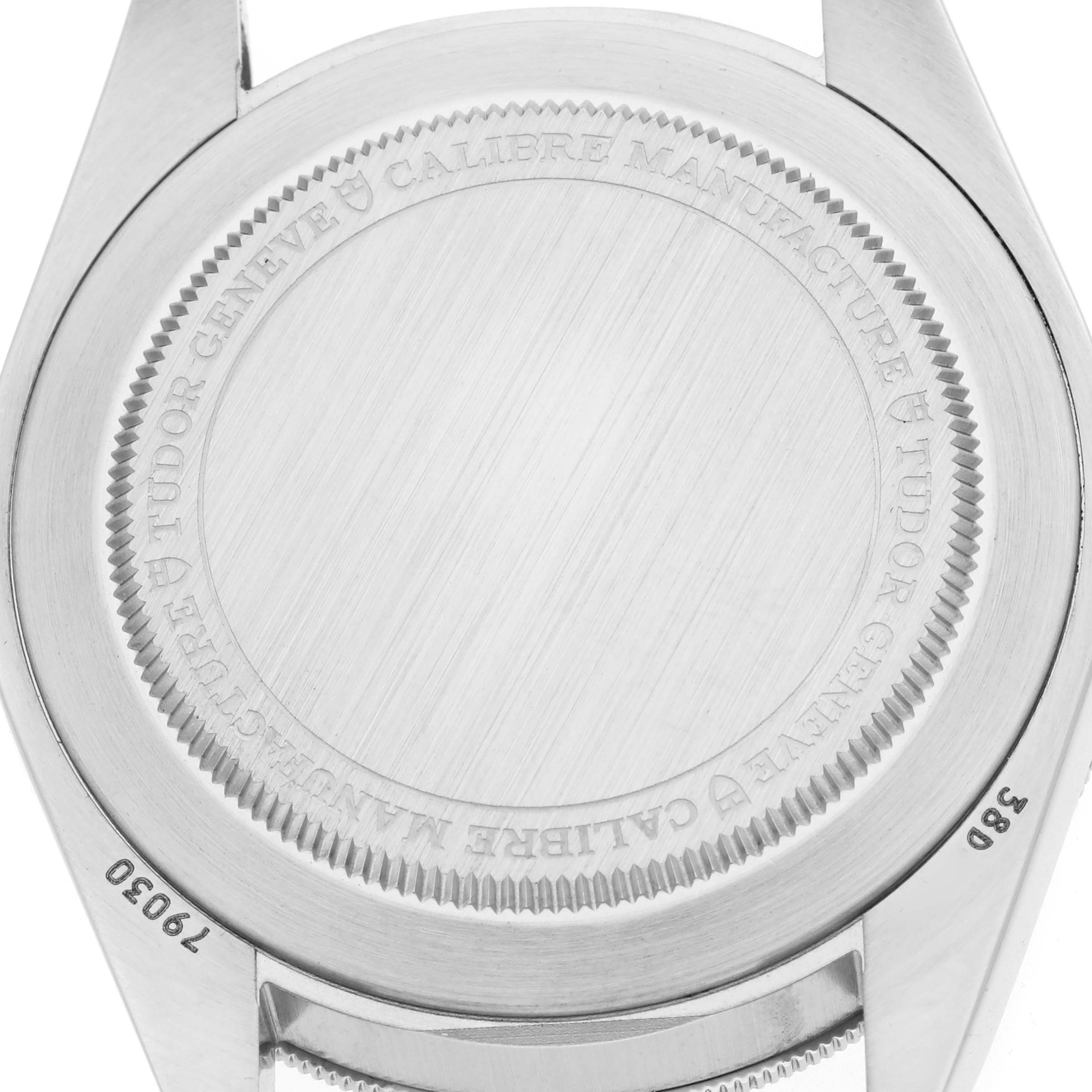 The image shows the back case of a Tudor Heritage Black Bay M79030N-0001 Men's Stainless Steel Black Dial watch at a straight-on angle, highlighting engraved details.