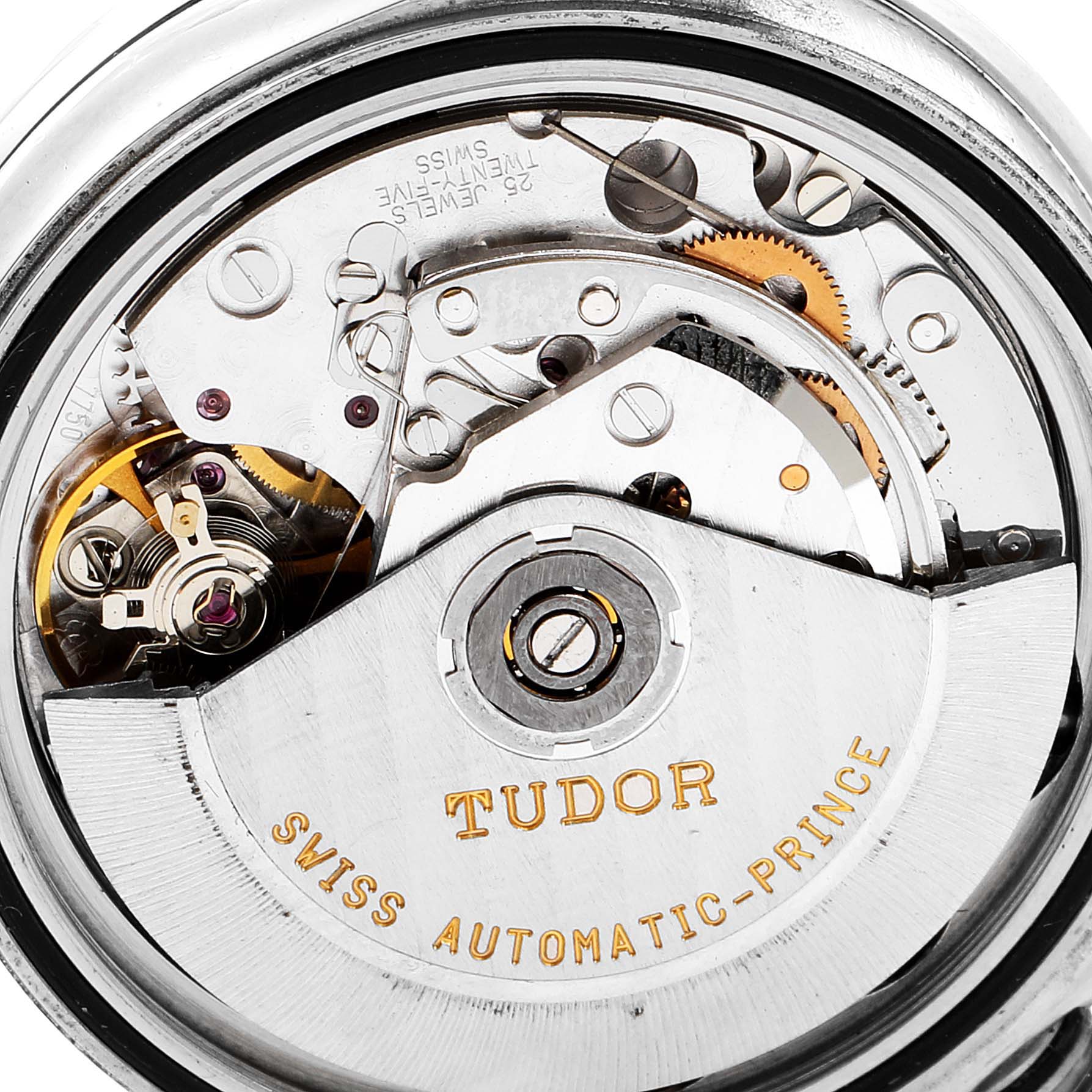 The image shows a close-up view of the internal mechanism of a Tudor Tiger 79280 Men's Stainless Steel Black Dial 79280 Men's Stainless Steel Black Dial model watch, highlighting its intricate movements and "Swiss Automatic-Prince" engraving.