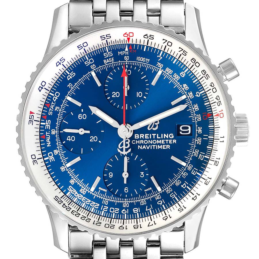 The Breitling Navitimer watch is shown from the front, highlighting its blue dial, chronograph sub-dials, and stainless steel bracelet.