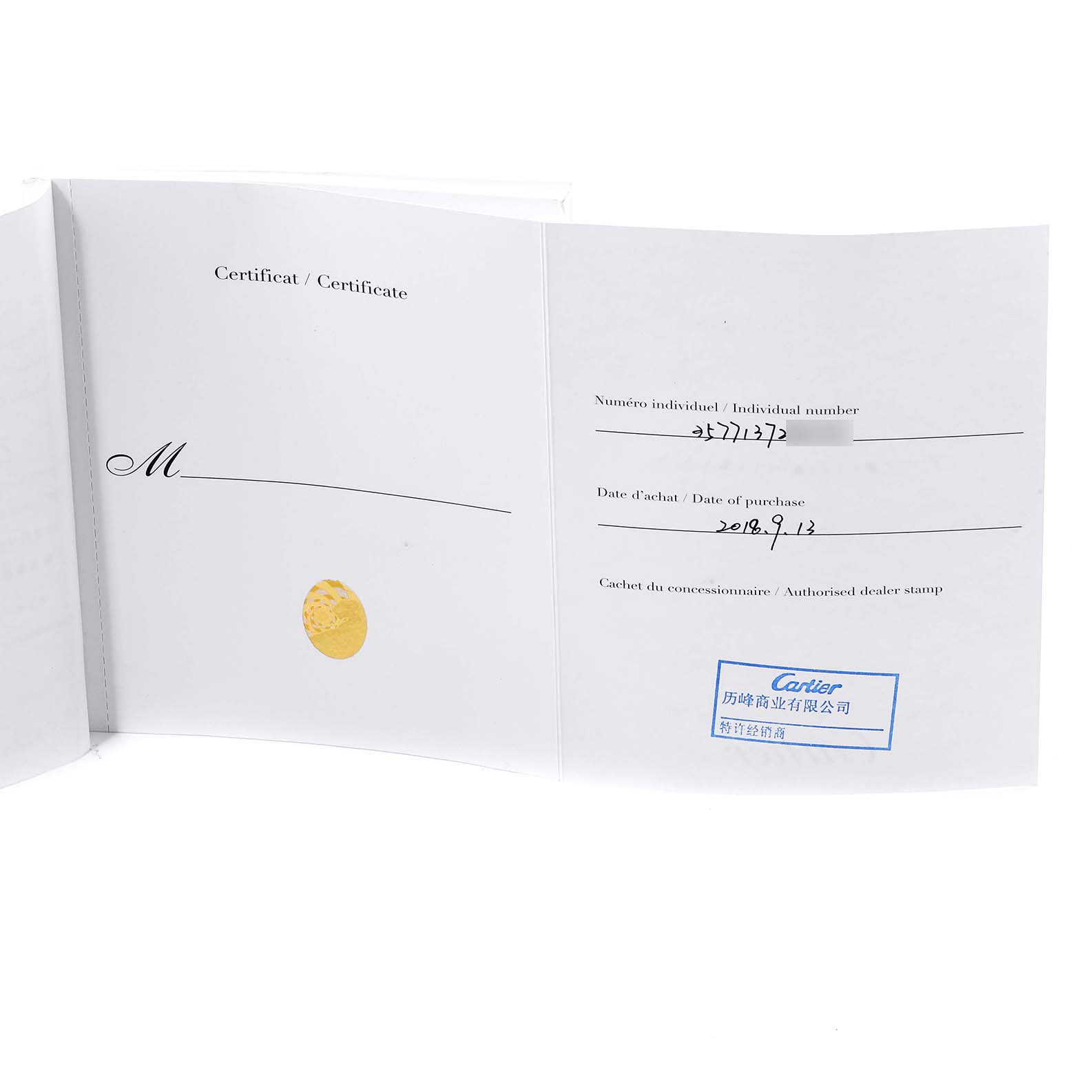 The image shows the open certificate booklet for a Calibre de Cartier watch by Cartier.